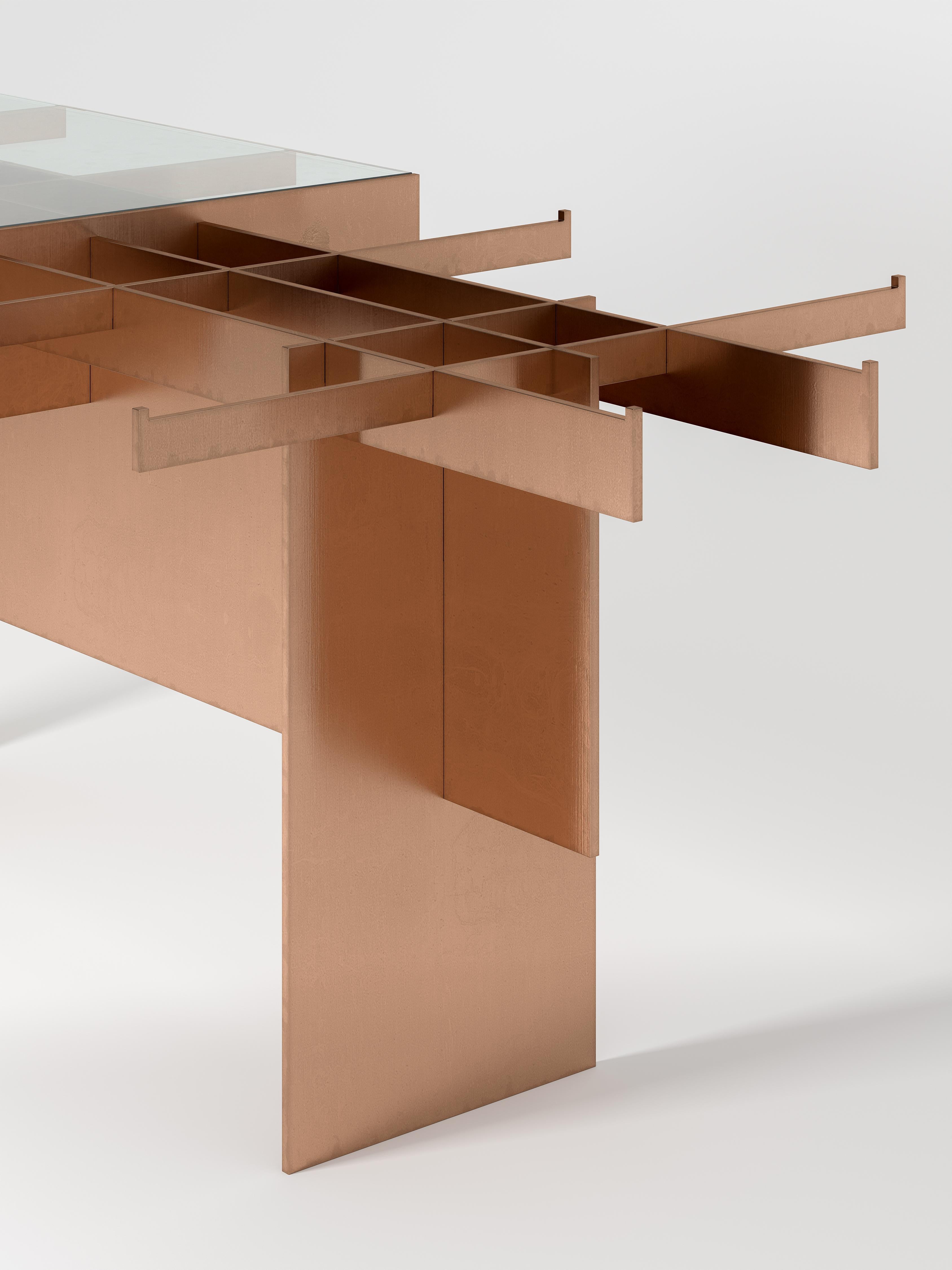 NMPBV1 is a dry joint copper and glass dining table part of a series of furniture items made from a standard metal carpentry process, which is 2D laser cut. From a single metal sheet, the objects are laser cut and dry assembled. ?NMPBV1 is made out