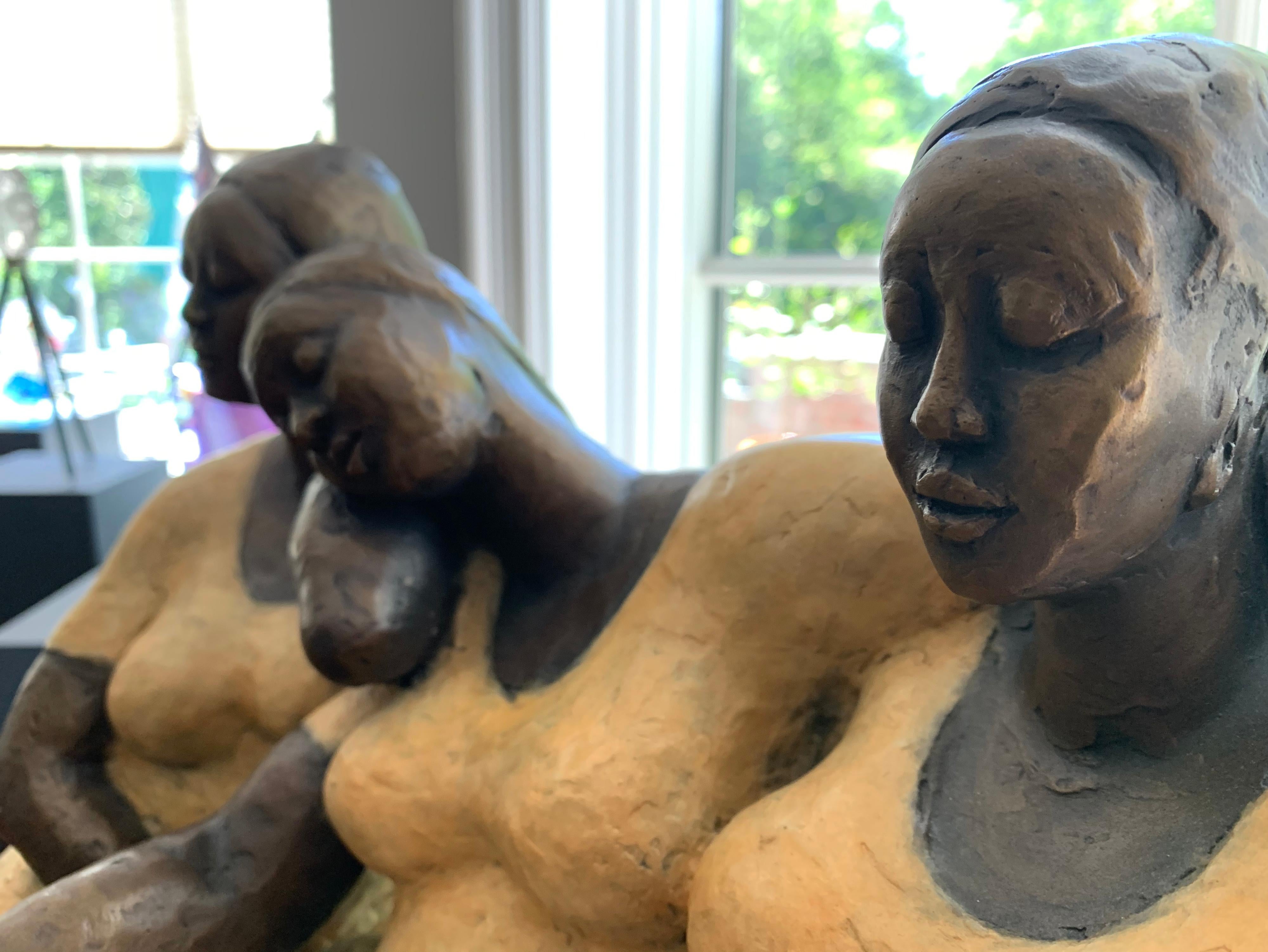 Nnamdi Okowkwo's stylized seated woman in an attitude of tranquility. To create it, he first sculpts the figure in clay, then casts it in bronze using the lost wax technique. A hot patina is applied using compounds that are specifically formulated