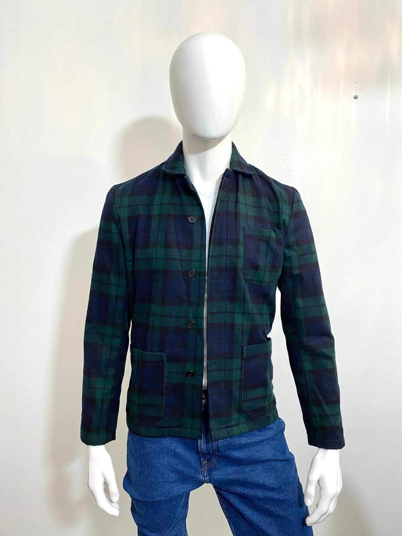 NNO7 Plaid Jacket

60% Wool in green, blue and black. One top open chest pocket and two larger waist pockets. Hidden button closure. Fully lined.

Additional information:
Size – S ( size label missing but corresponds to Small)
Condition – Very Good