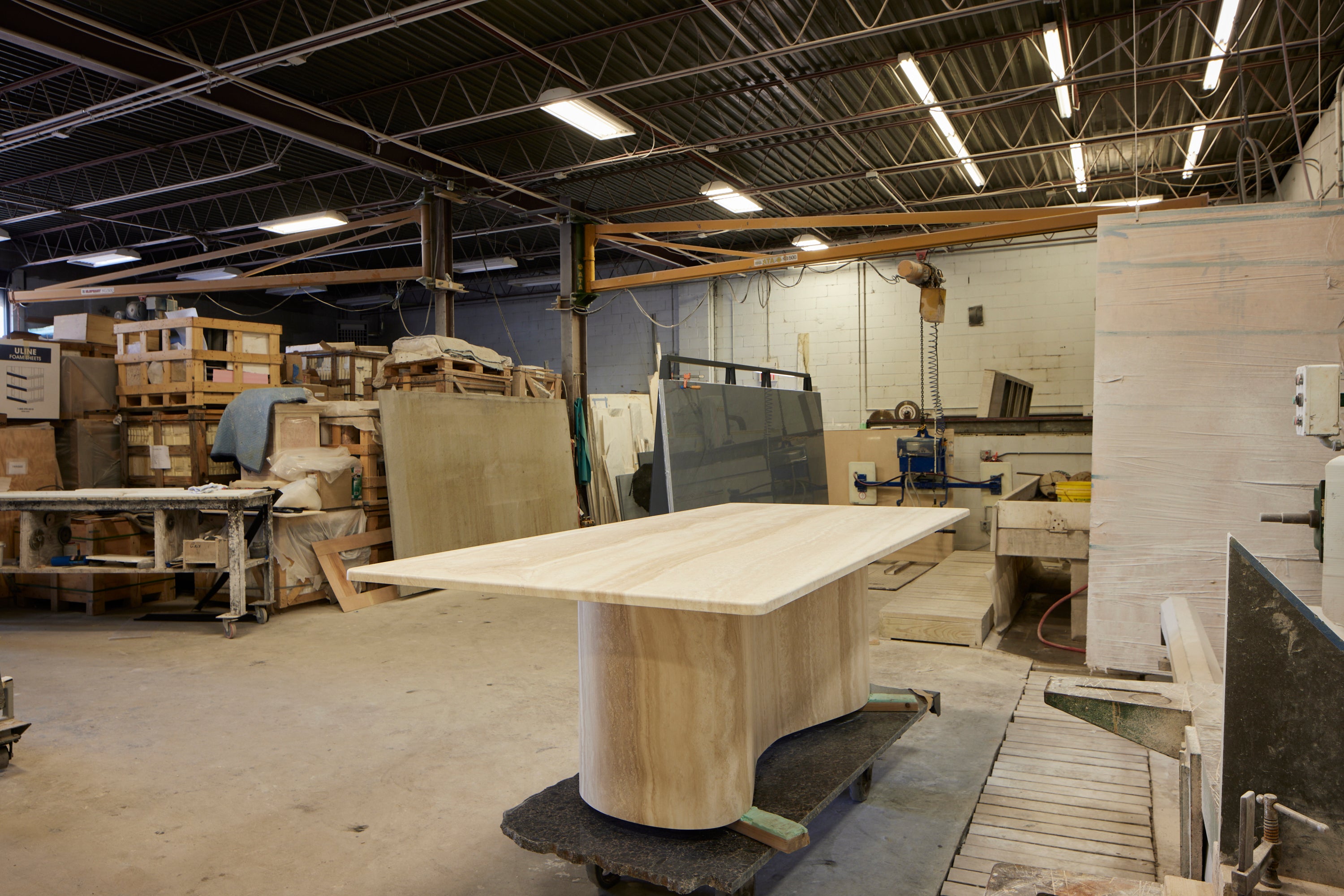 This dining table is meticulously crafted with vein cut travertine stone. The pedestal base (drawn by hand) is an asymmetrical form which is beautifully varied from every angle.

A solid slab of travertine floats across with the pedestal base with