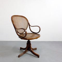 No. 11 swivel desk chair with curved wooden frame and caned seat and back -