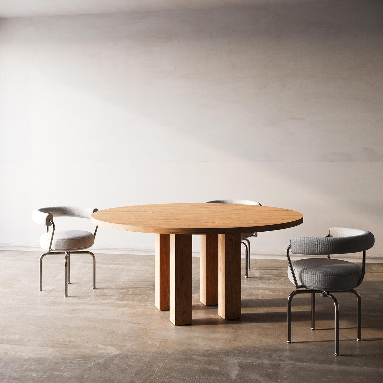 This piece quietly challenges the archetype of a table with the unexpected proportion of the legs and hidden detailing. A single plane effortlessly floats atop four oversized wood legs.

Beautifully crafted with high grade solid wood and handmade