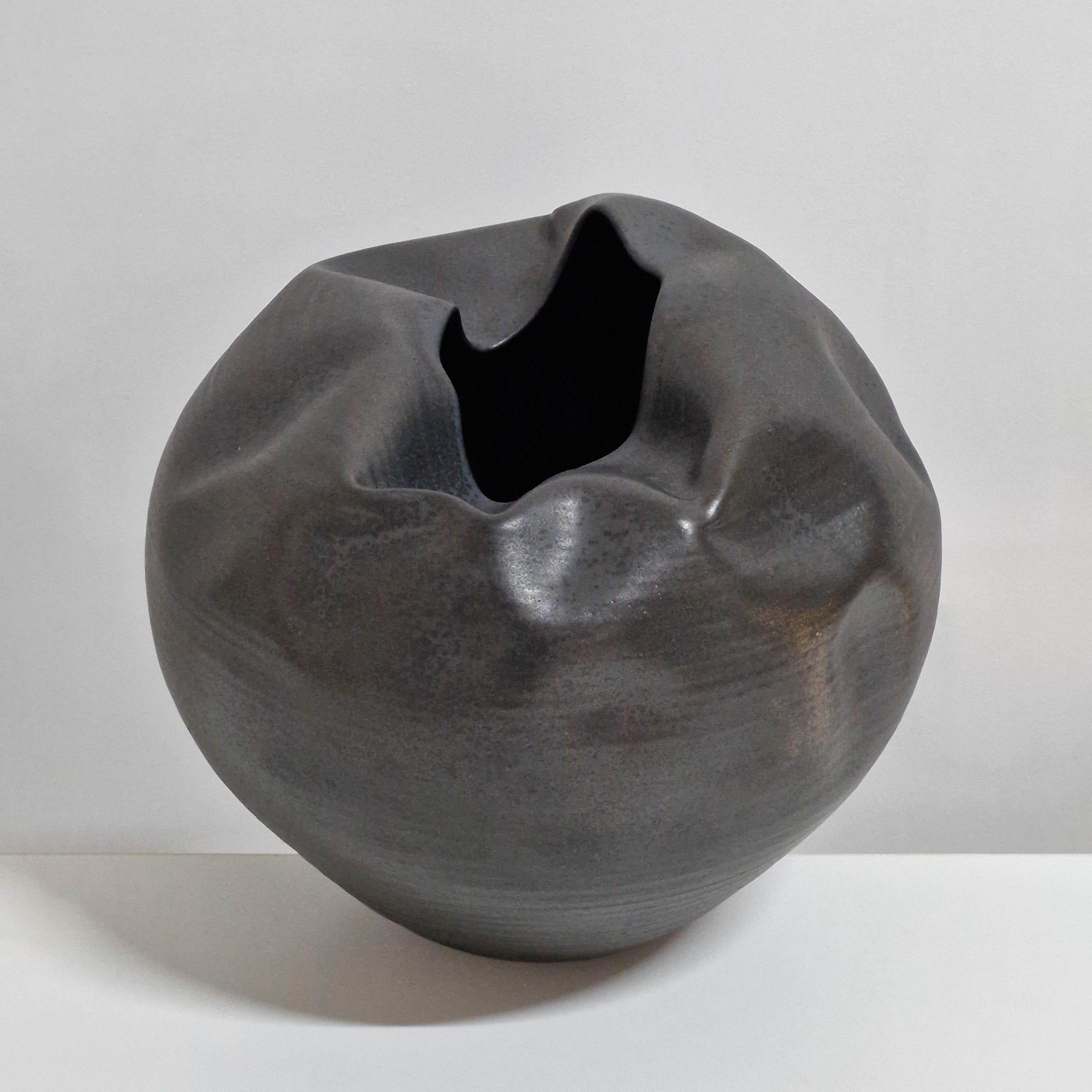 Vessel No. 155 'Breathe In' enclosed black form sculpture vessel from ceramic artist Nicholas Arroyave-Portela. 

Materials: White St. Thomas clay, stoneware glazes, multi fired to cone 9 (1260 degrees) 

Made in 2018

Dimensions: 28 cm tall, 34 cm