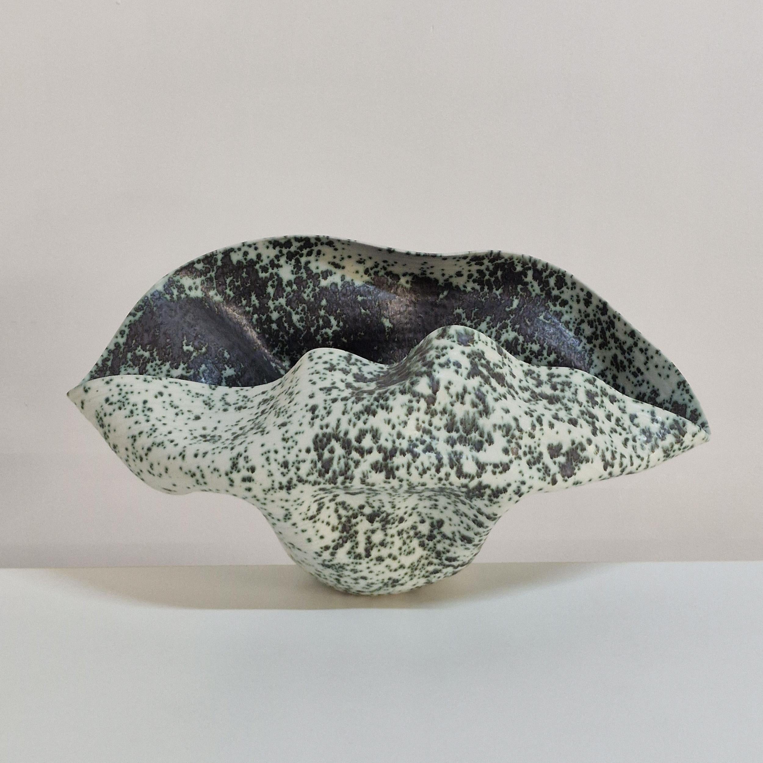 Vessel No. 159, wide undulating open form with a mint green and charcoal black speckled glaze. Unique ceramic sculpture.

Materials: White St. Thomas clay, stoneware glazes, multi fired to cone 6 (1223 degrees) 

Made in 2025

Dimensions:

28 cm