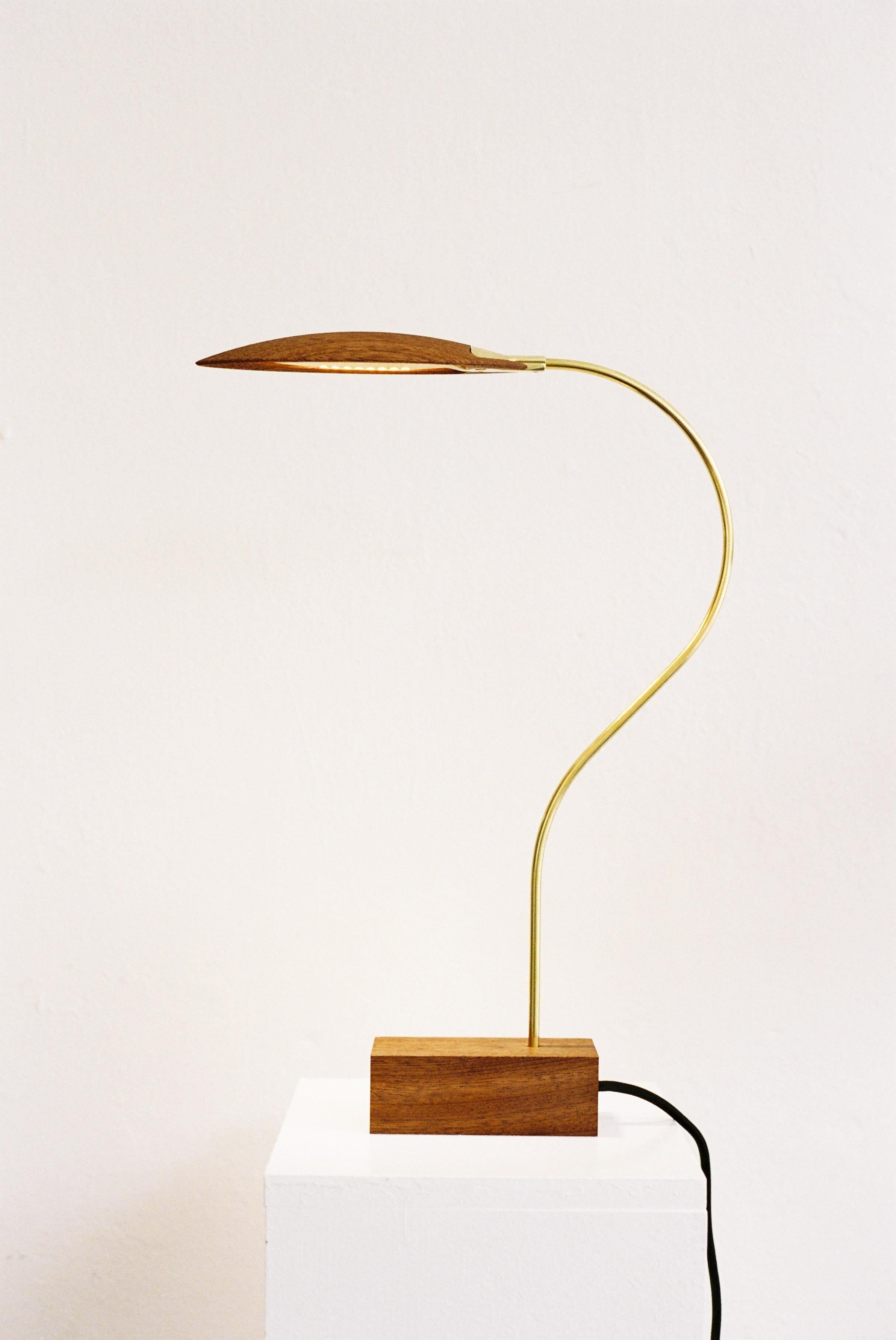 No. 2 table lamp by Mernoe
Dimensions: D30 x W 5,5 x H 45cm
Materials: Wood, Metal.
Wood options: Sipo Maghoni, smoked oak, ash, walnut.
Metal options: Polished brass, glasblown brass, chrome.

NO. 2 is the second design of Morten Mernøe. A