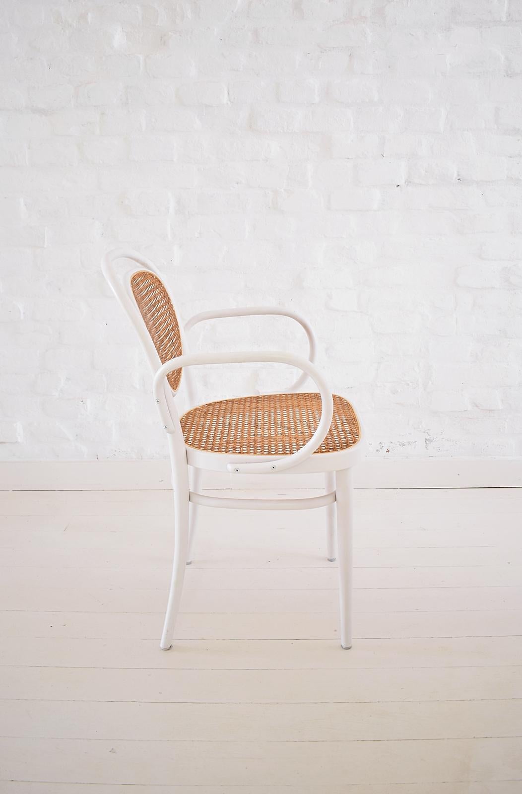 This Thonet no. 215 chair was manufactured 2002 (as marked underneath the seat)
The chair was designed by Michael Thonet in 1859.
It features heat-moulded beech cane seat and back.
  