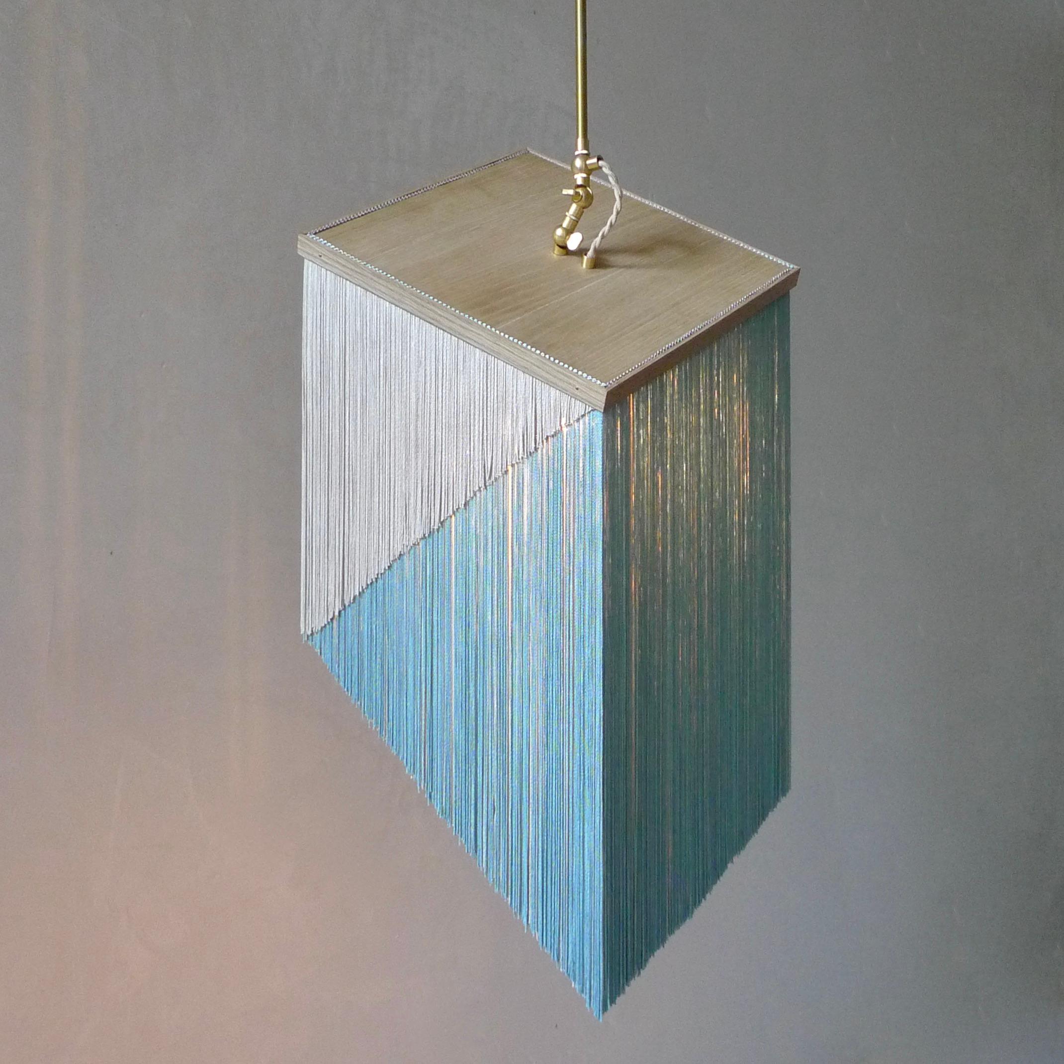 No. 25 Pendant Lamp by Sander Bottinga
Objet size 3
Dimensions: H 46 -80 x W 31 x D 31 cm
Materials: Brass, Wood, Leather, Viscose Fringes
Variations available.

Handmade in brass, wood, leather and 3 double layered viscose fringes in
geometric cut