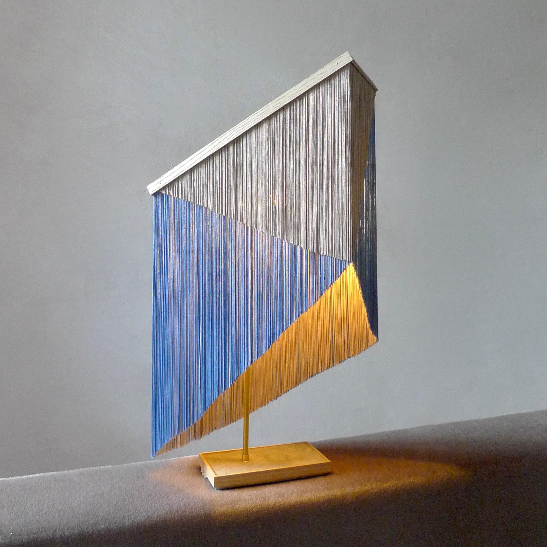 No. 30 Table Lamp by Sander Bottinga
Object size 2
Dimensions: H 57-71 x W 41 x D 17 cm
Materials: Brass, Wood, Leather, Viscose Fringes
Variations available.

Handmade in brass, wood, leather and 3 double layered viscose fringes in

geometric cut