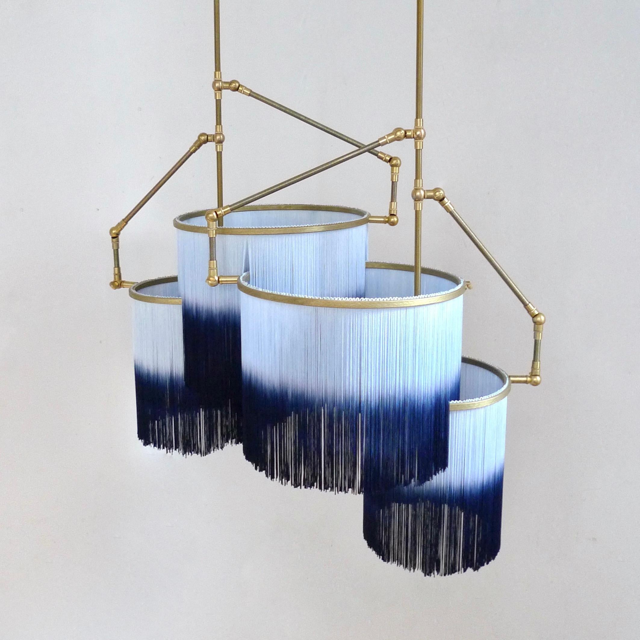 No. 31 C pendant lamp by Sander Bottinga
Dimensions: W 68 x D 44 x H 50 cm.
Materials: brass, leather, wood. Deep dyed color fringes in viscose.

Also available in dark yellow and light yellow, green and light green, blue and light blue, reddish