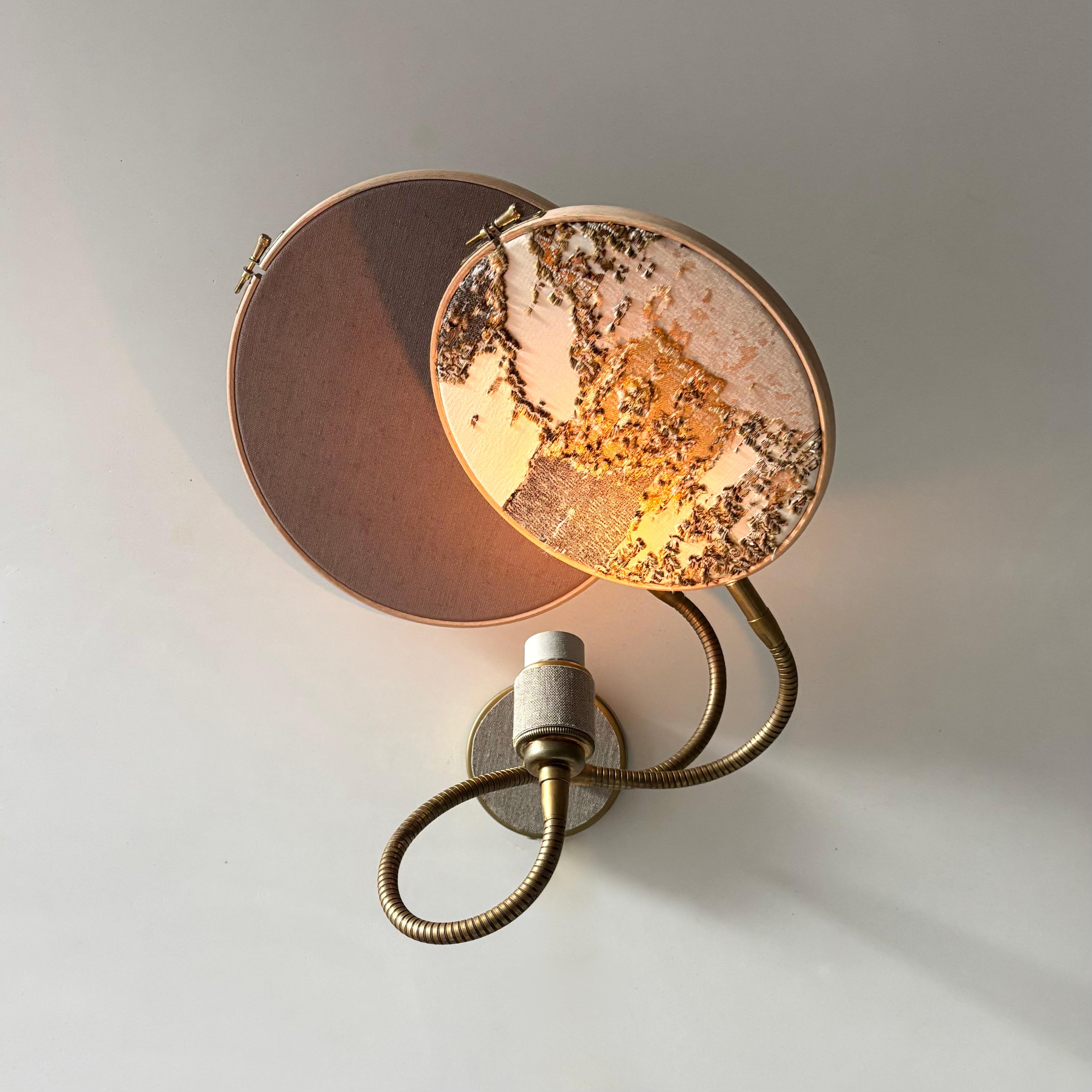 No. 33 Wall Lamp, 2 Circles, by Sander Bottinga
Dimensions: D 25 cm x W 38 cm x H 40 cm
Materials: brass, wood, stone color hand-painted linen, marble embroidered design in silk, viscose, cotton.

Available with 2 circles or 1 circle.
Available in
