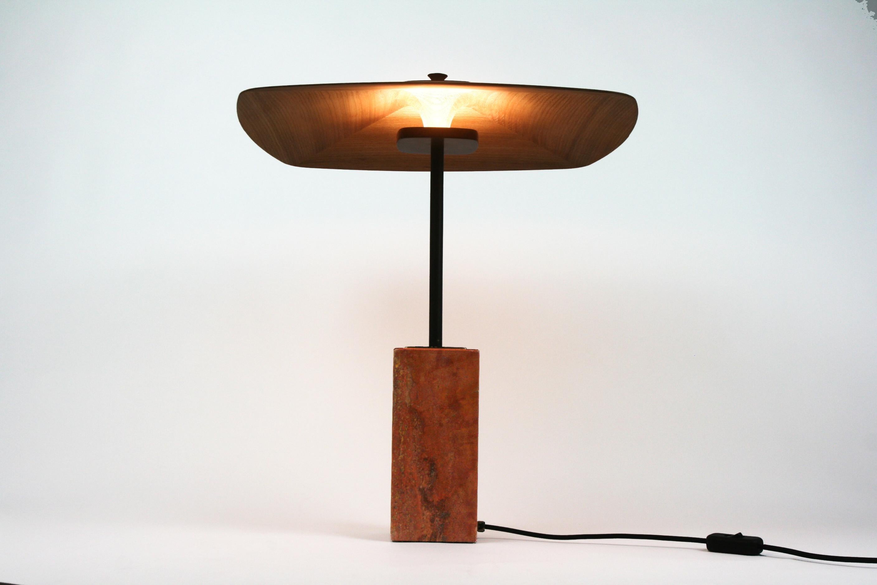 No. 5 Table Lamp by Mernøe
Dimensions: D 47 x W 47 x H 52 cm
Materials: Wood, Brass.

Available in Ash, Sipo Mahogany, Walnut, or Elm wood options.


Table lamp in wood, brass and travertine. The wood serves as both screen and reflector for the LED