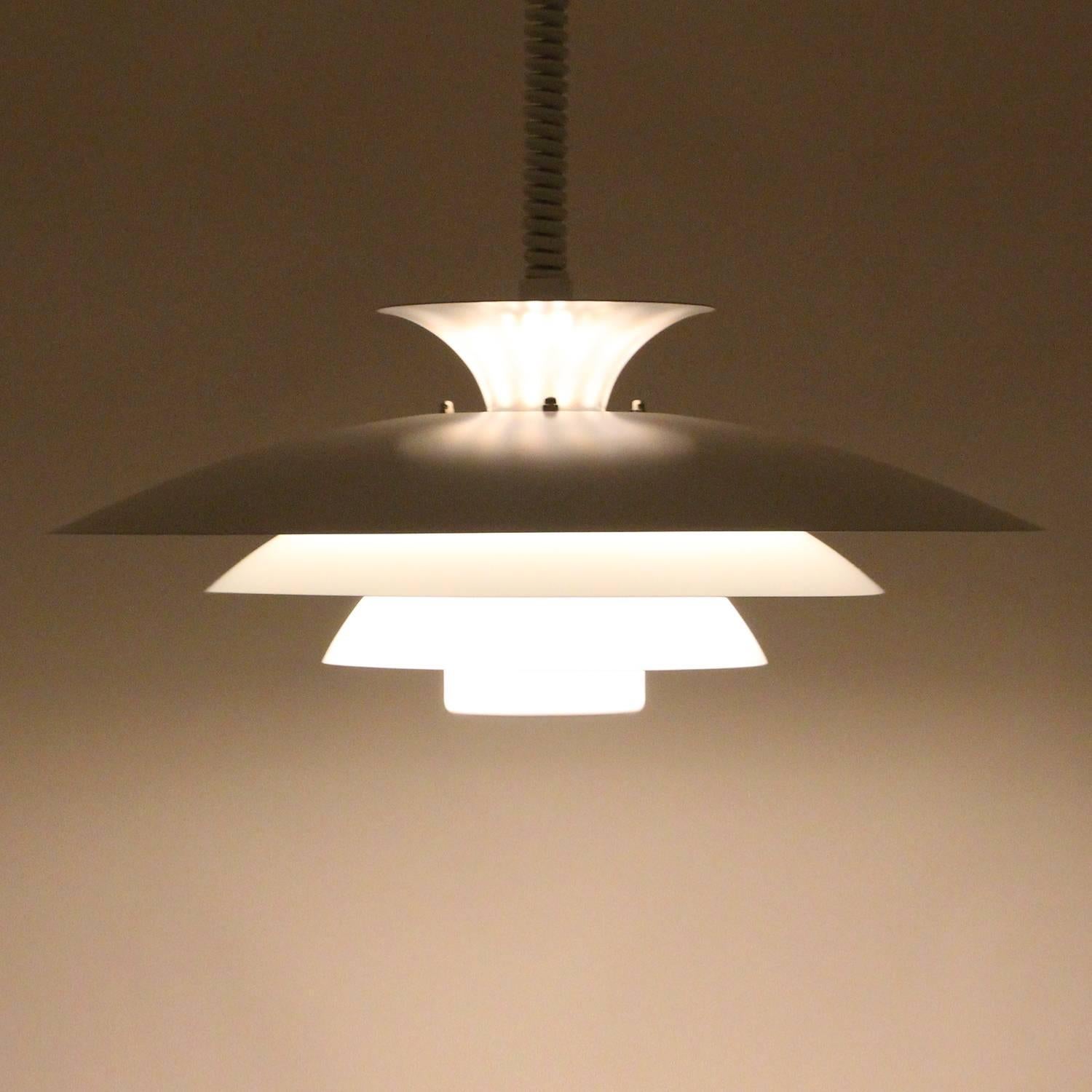 NO. 52511, white pendant light by Danish Form-light in the 1970s - beautiful large ceiling lamp with rise and fall suspension, in excellent vintage condition.

A stylish hanging lamp, built in a supreme quality (the trademark of Form-light's