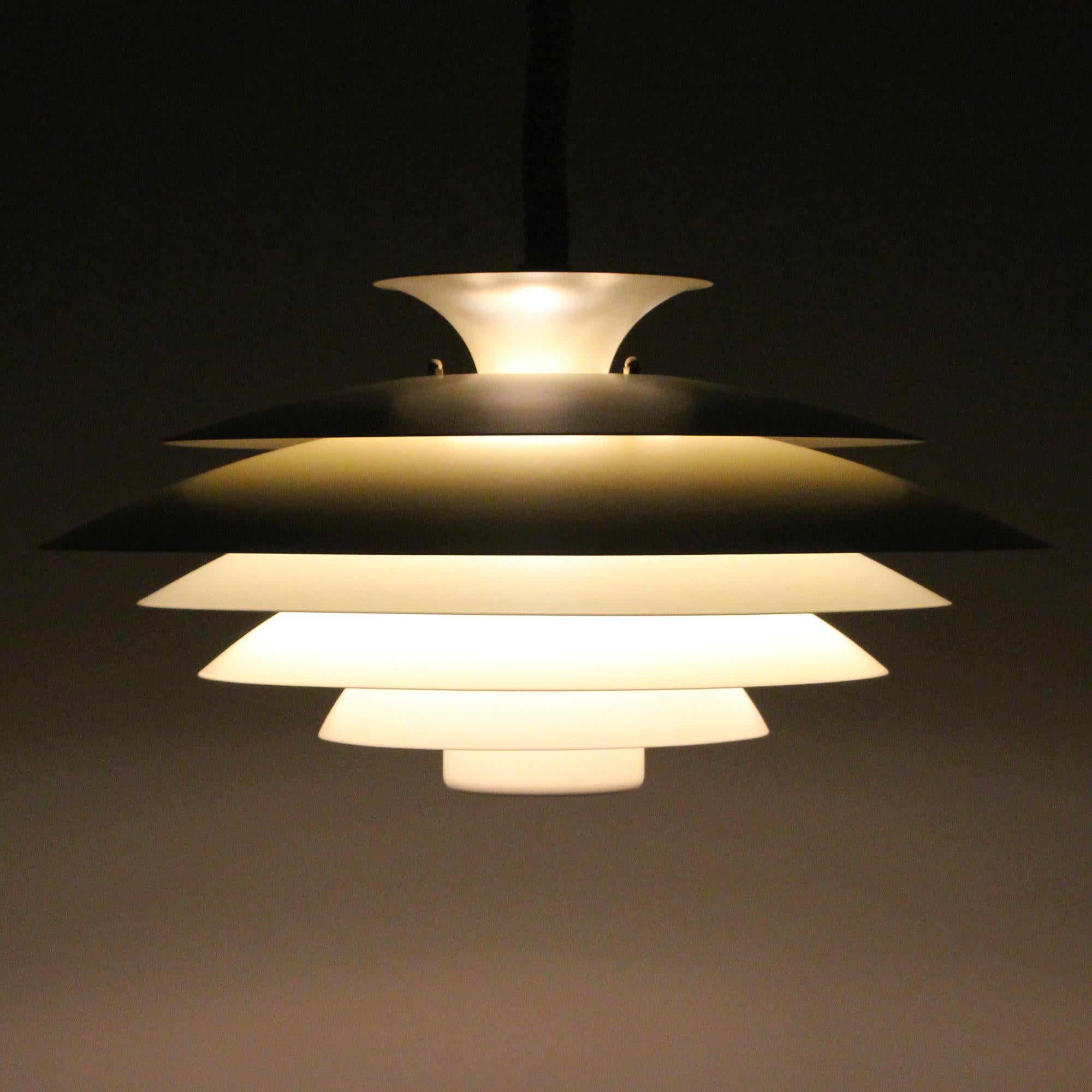 NO. 52580, large white lamp by Danish Form-Light in the 1980 - stylish white hanging light in very good vintage condition.

A multi-layered pendant with five circular white powder coated metal shades, placed on white/yellowish lacquered metal