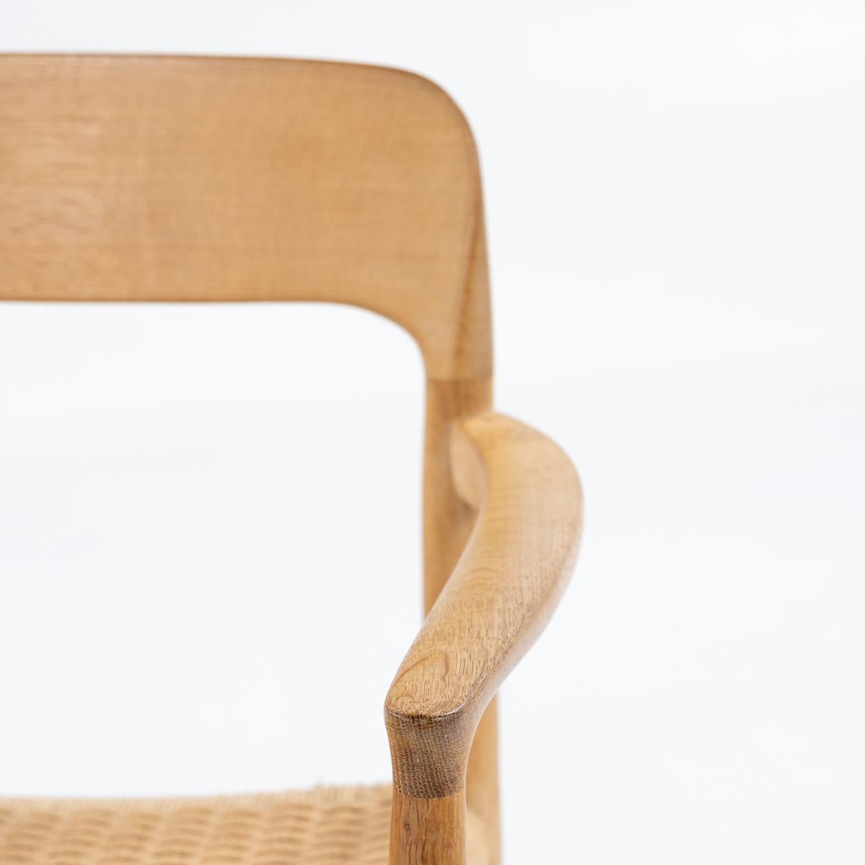 Patinated NO 56 armchair in oak by Niels O. Møller For Sale