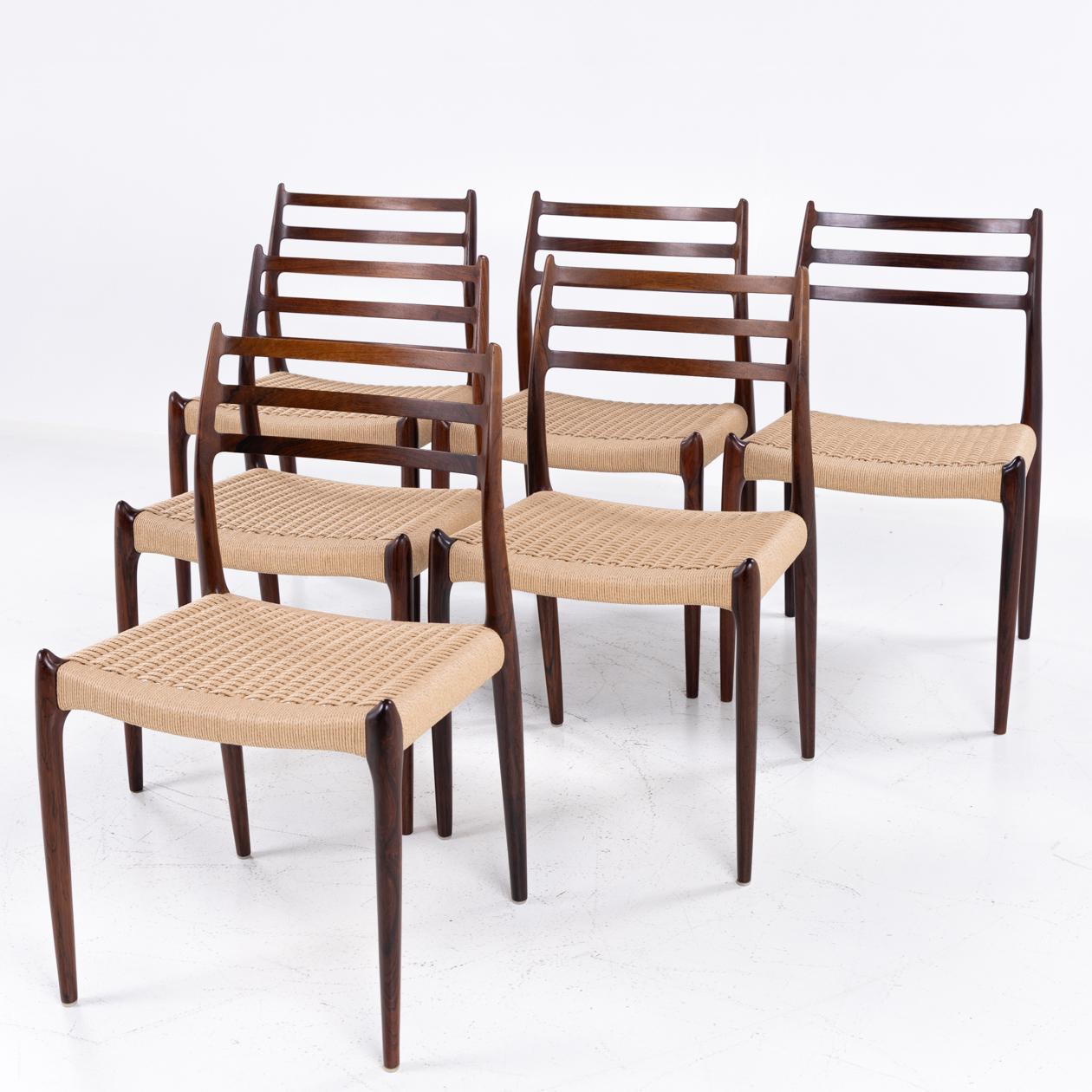 NO 78 - Set of 6 dining chairs in solid rosewood and newly renovated seats in woven paper yarn. 
Designed in 1962 by Niels Otto Møller, made by J. L. Møllers Møbelfabrik.