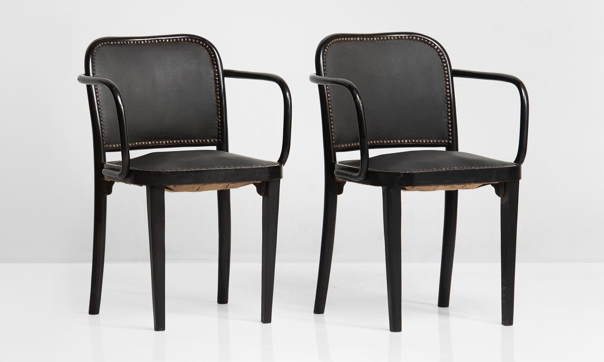 No. 811 armchair by Josef Hoffman, Austria, circa 1925.

Blackened bentwood frame with studded coated canvas upholstery on seat and back.
