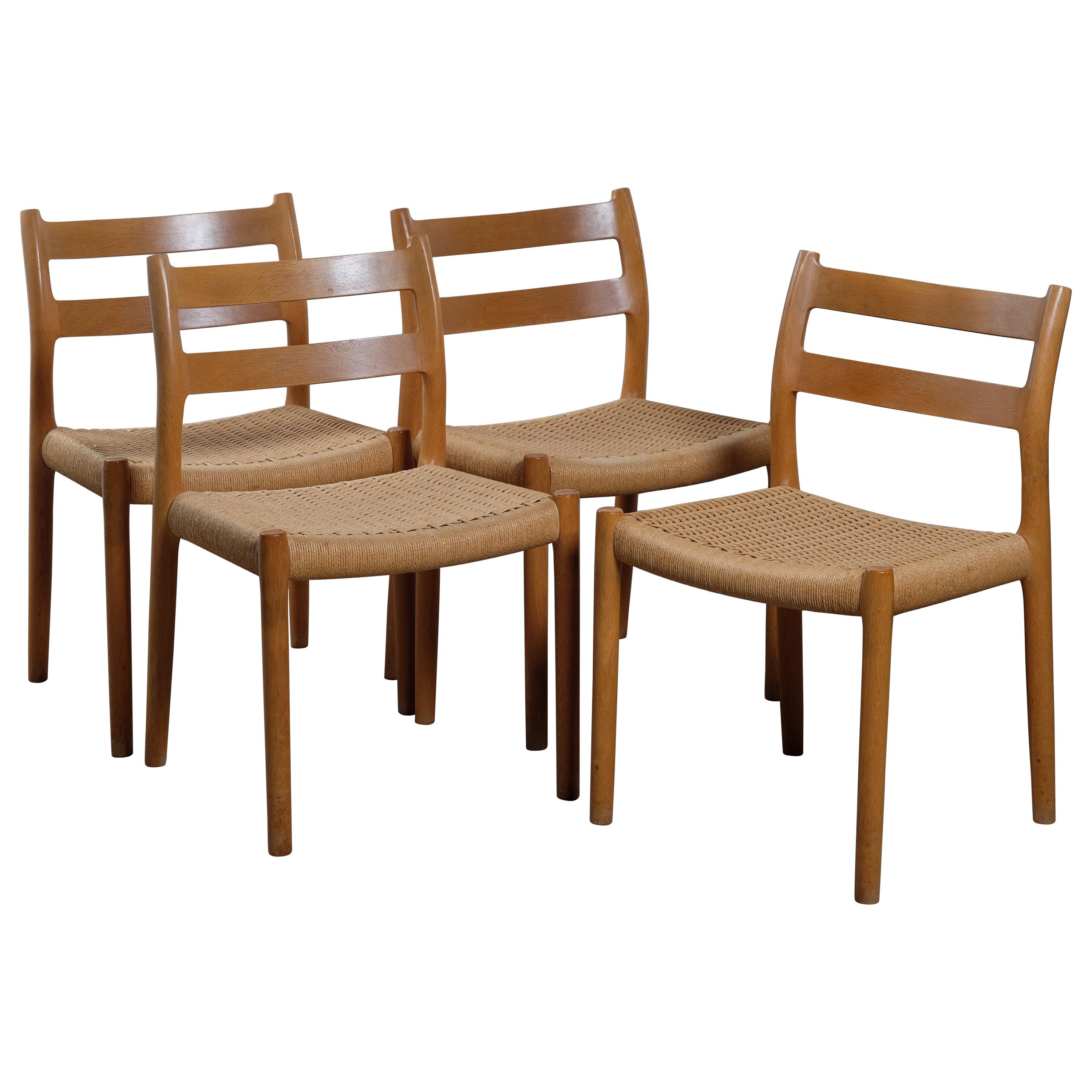 No. 84 Oak Dining Chairs with Paper Cord Seats by Niels Otto Møller For Sale