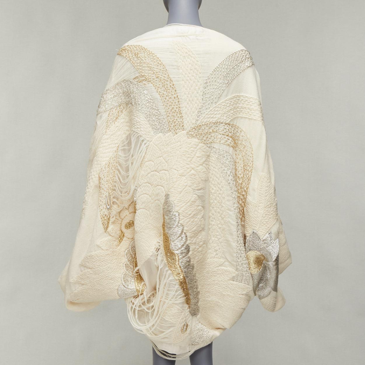 NO BRAND cream gold silver embroidery fringe applique oversized shawl
Reference: NKLL/A00230
Brand: No Brand
Material: Feels like wool
Color: Cream, Gold
Pattern: Solid
Lining: Cream Fabric

CONDITION:
Condition: Good, this item was pre-owned and is
