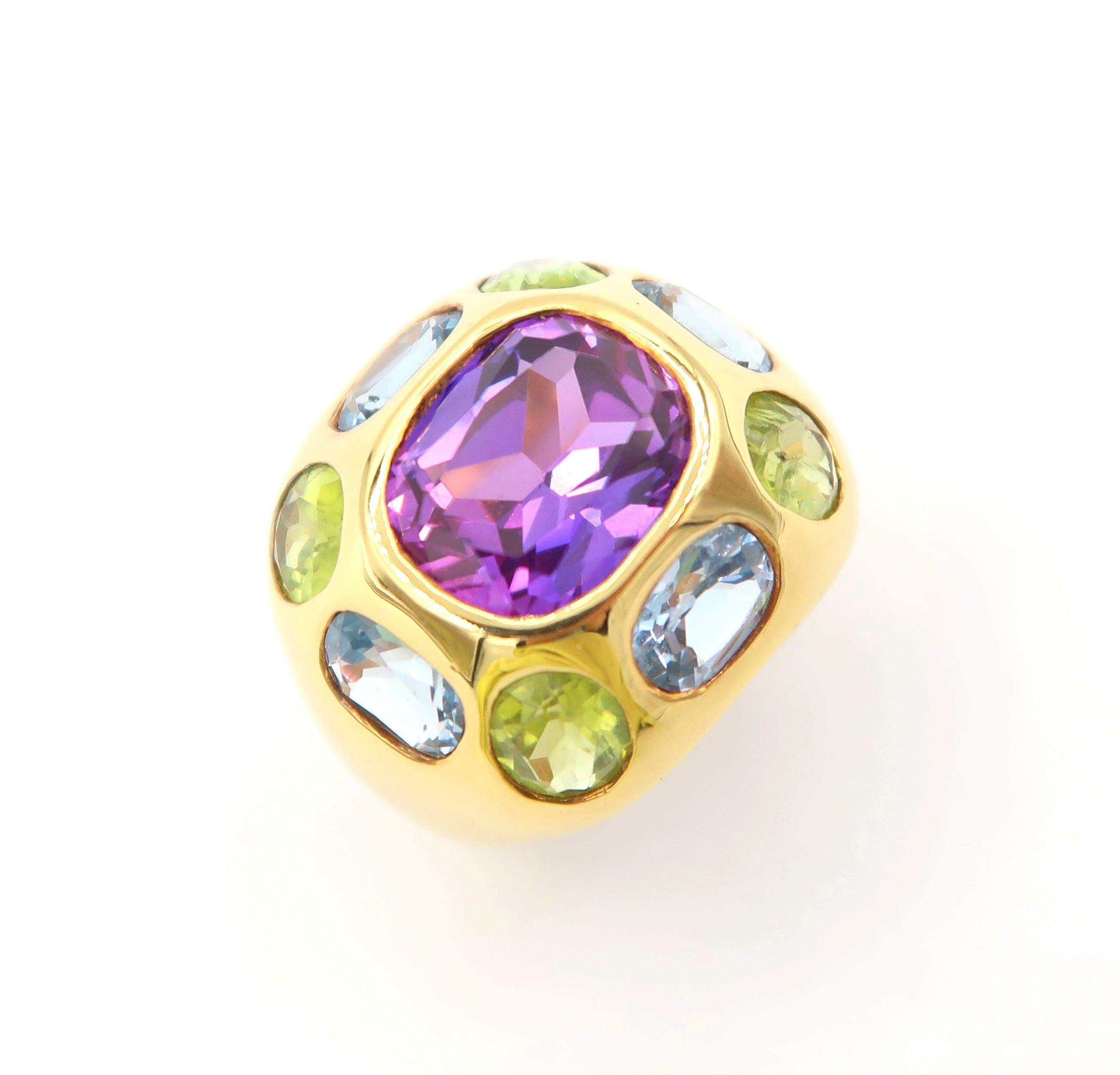 Cushion Cut Amethyst 18K Yellow Gold Cocktail Ring embellished with Peridot and Blue Topaz in the Colours of Mayfield Lavender Fields

Amethyst, Peridot, Blue Topaz: 8.71 ct
Gold: 18K Gold, 12.922 g

Ring size: 52 / US 6

Please let us know should