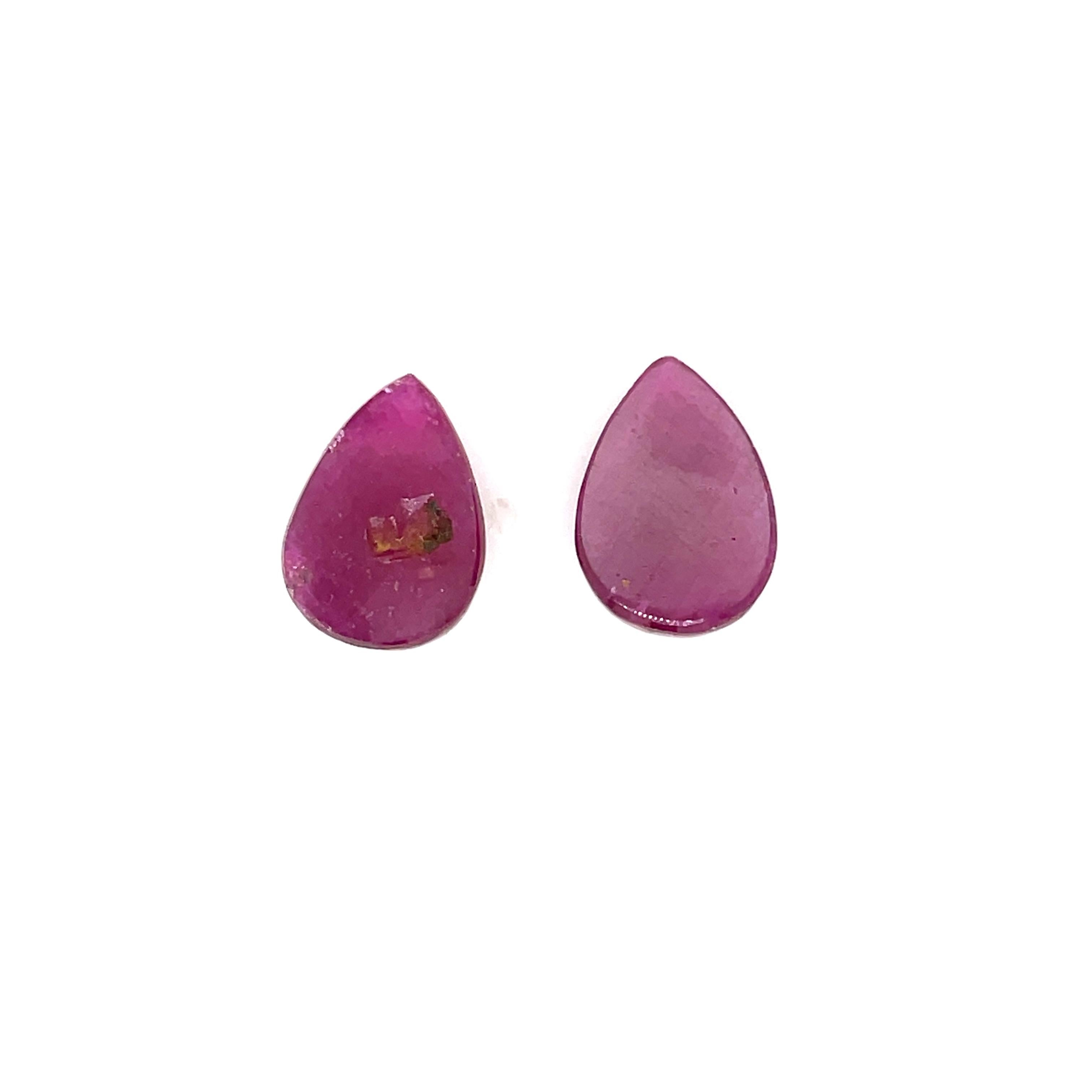 Sourced from the heart of India, these mesmerizing pear-shaped buff rubies boast a total weight of 20.22 carats, measuring 15.24 x 11.09 x 5.92 mm and 15.67 x 11.06 x 6.17 mm. 

These exquisite gems, untouched by heat treatments, exude a natural