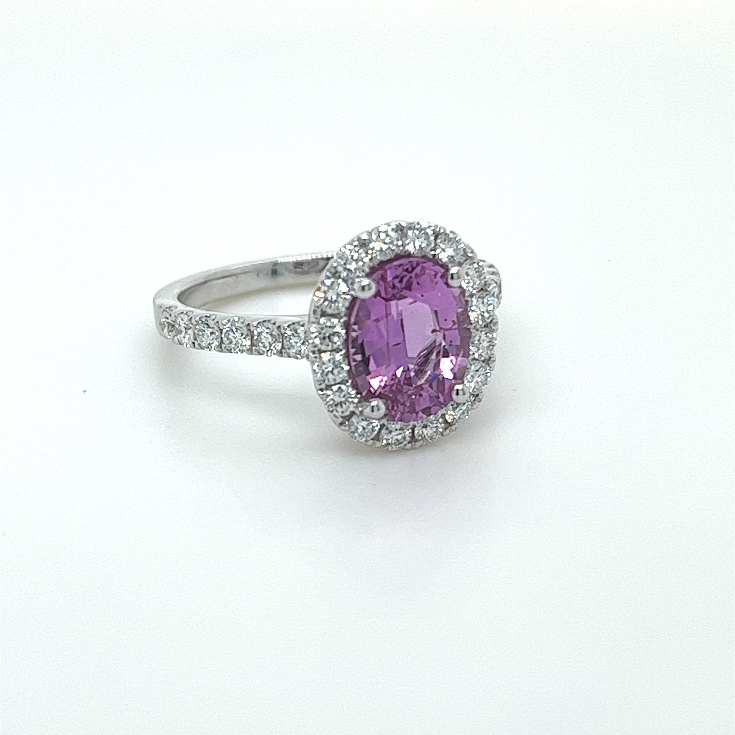 No Heat Oval Pink Sapphire weighing 2.27 carats
Measuring (8.80x6.80x4.50) mm
27 Round Diamonds weighing .67 carats
Diamond Grade: GH VS2-Si1
Set in 18k white gold ring
3.91 grams
Halo style ring