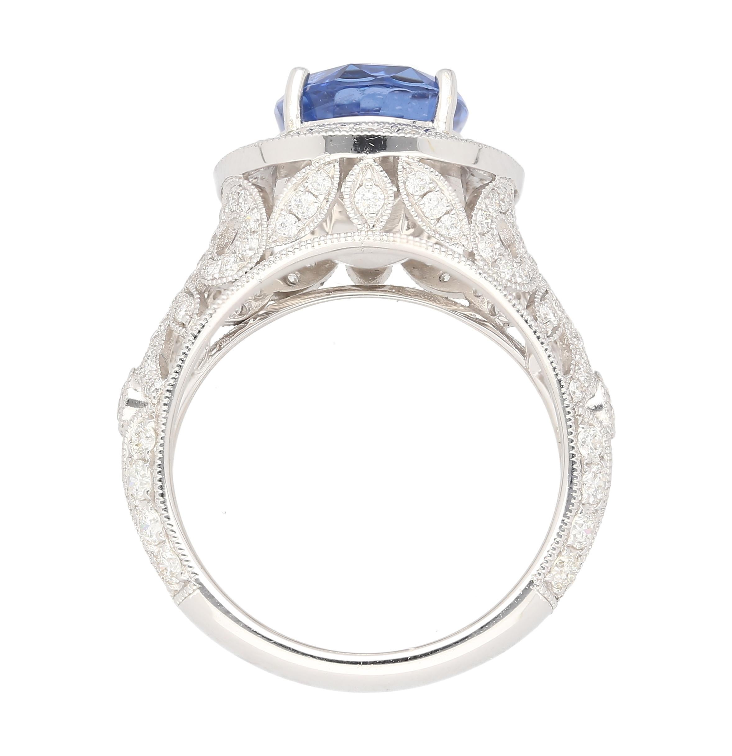 Sapphire with Diamonds in 18K White Gold Engagement Ring. 

This Ceylon GIA certified oval-cut natural sapphire exudes a violet-blue hue and weighs 4.84 carats. Non-treated sapphire. Adorned with 124 round-cut white diamonds weighing 1.25 carats