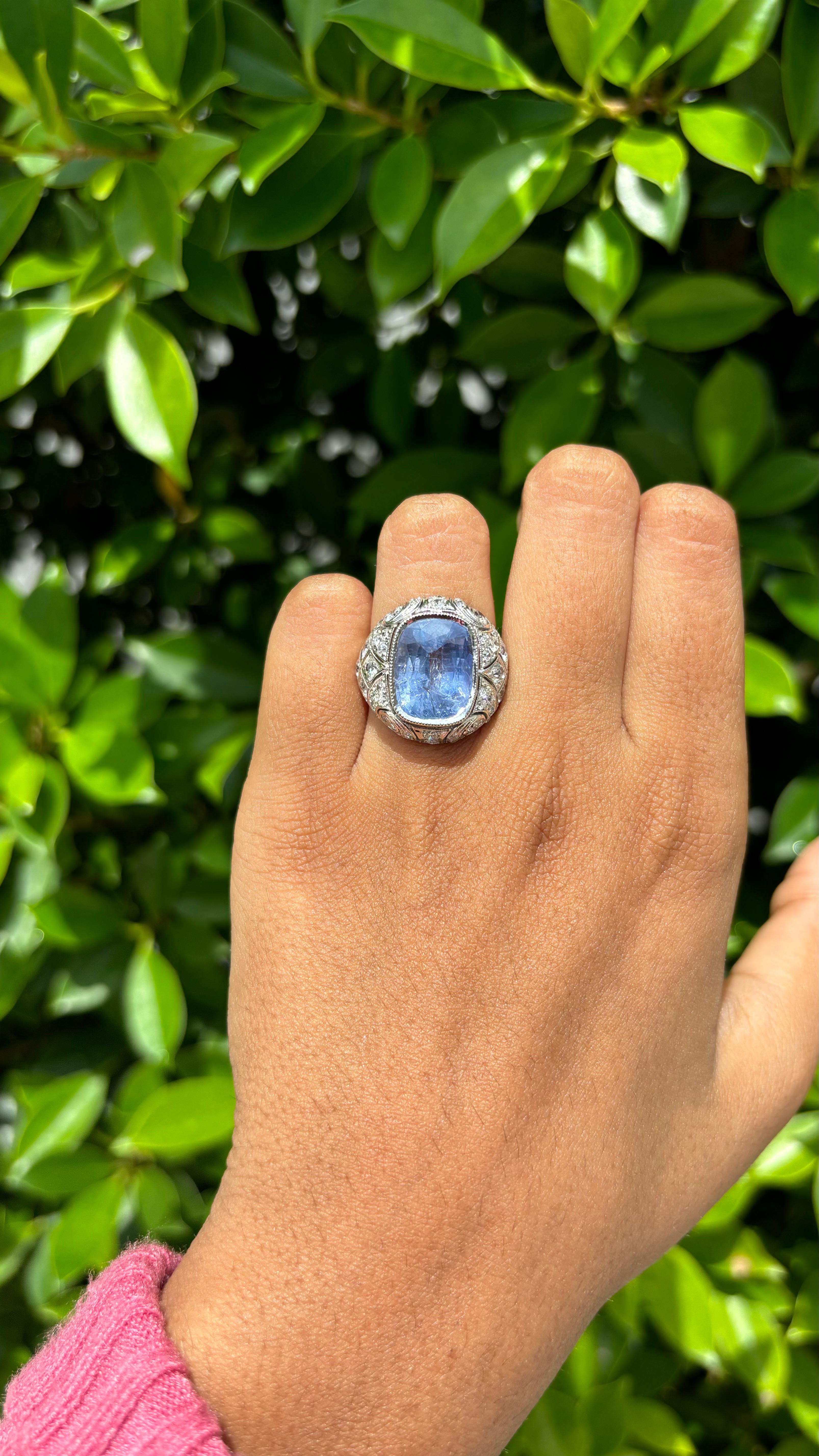 Introducing our gorgeous 8.05 Carat Sapphire Ring! It's a true beauty, carefully crafted with attention to every detail. The centerpiece is a stunning sapphire that has a cornflower blue hue. The sapphire is surrounded by shimmering diamonds, all