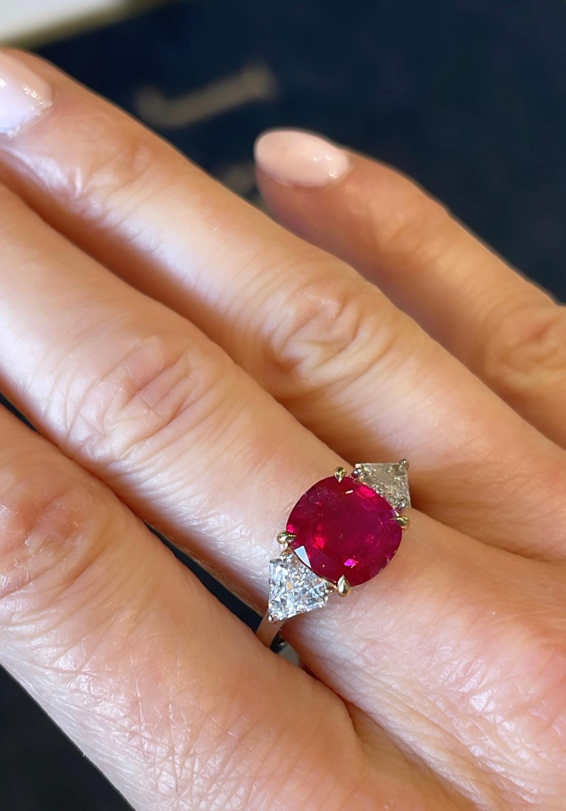 A 3.15 carat no-heat Cushion Burmese ruby as stated in the accompanying GIA Ruby Origin Report, set in a platinum and 18k gold ring with two kite shaped diamond side stones (.80 ctw).  
The ring was recently recut to beautify the natural color.