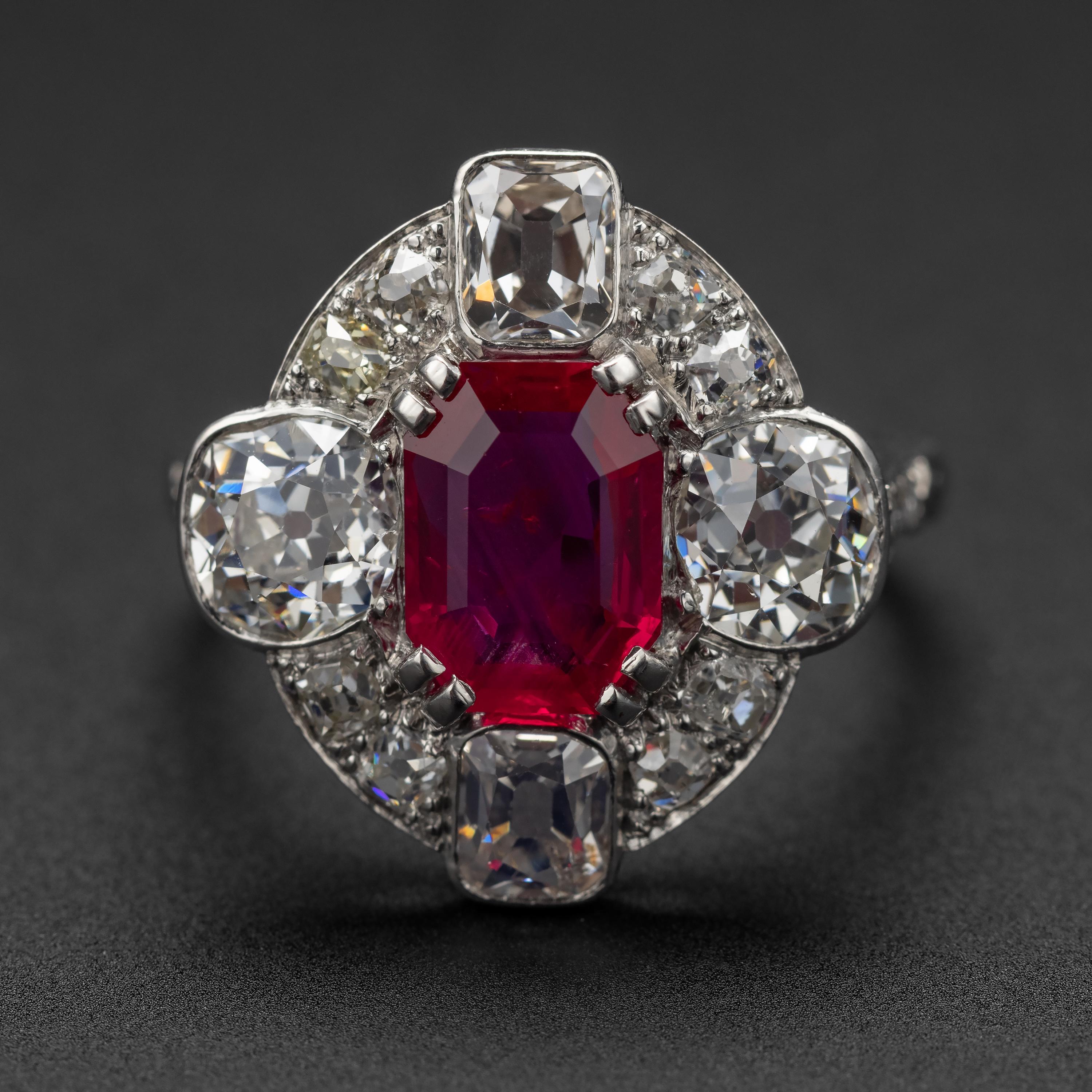 This sleek, dazzling ring of incomparable beauty and quality from the Art Deco era features as its focal point the most magnificent vivid red AGL-certified un-heated natural Burmese ruby weighing 2.24 carats. Surrounding this exceedingly rare and