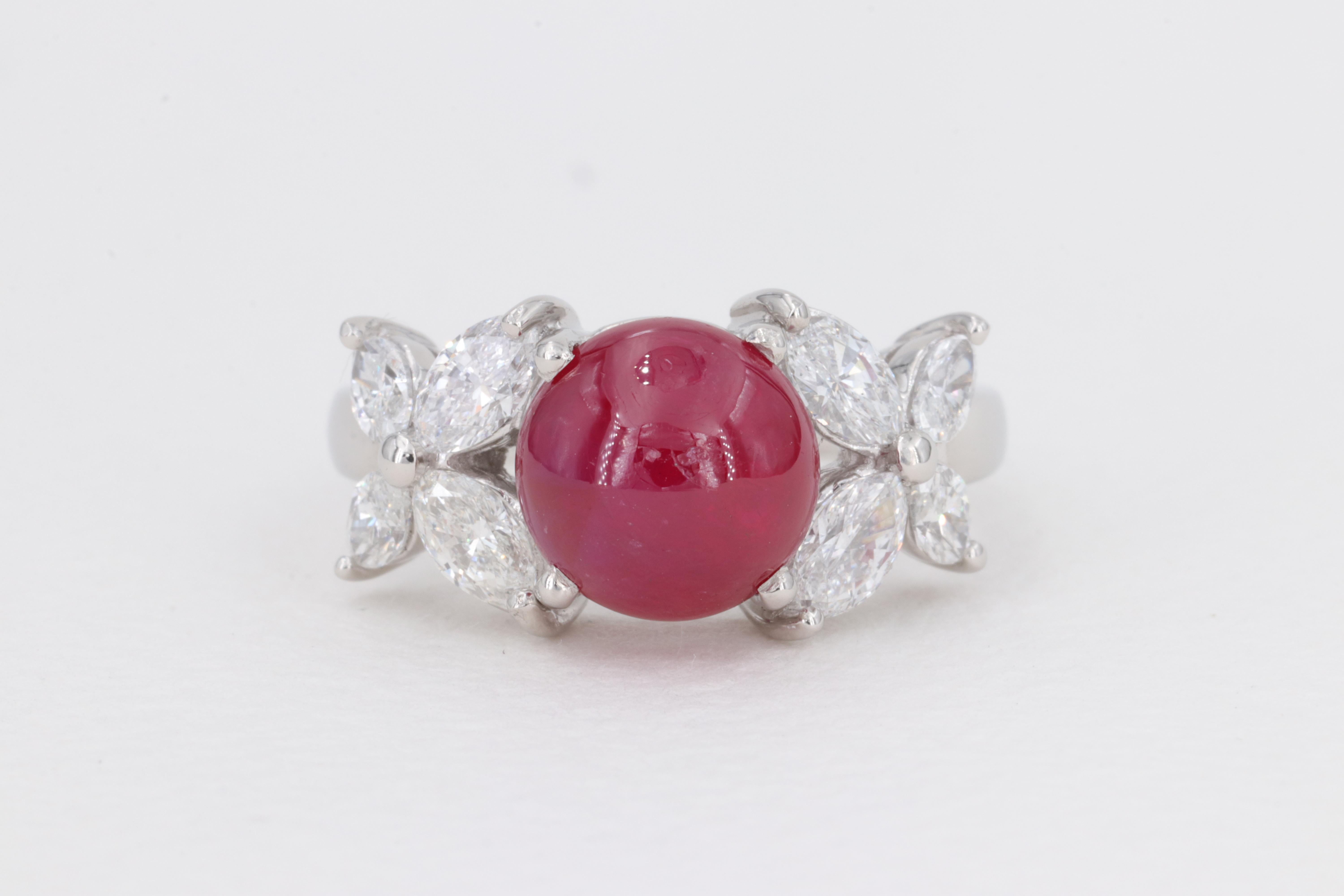 No Heat Cabochon Ruby G.I.A. Set in Plat Ring with Marquise Diamonds

Ruby:

Weight - Approximately 3.39 Carats
Measurements - 8.10 x 8.18 x 4.75
Shape - Cabochon 
Treatment - No Gemological Indications of Treatment
Origin - Afghanistan 
G.I.A.