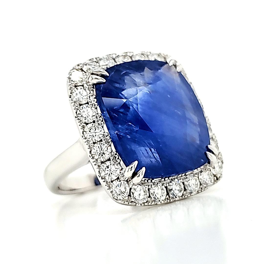No heat Cushion Burma Sapphire cts 19.06 and Diamond Engagement Ring


A large and original crystal formed in the depths of Burma centuries ago - ultimately discovered and cut into a fine cushion shaped faceted stone.

It is surrounded by 24 fine