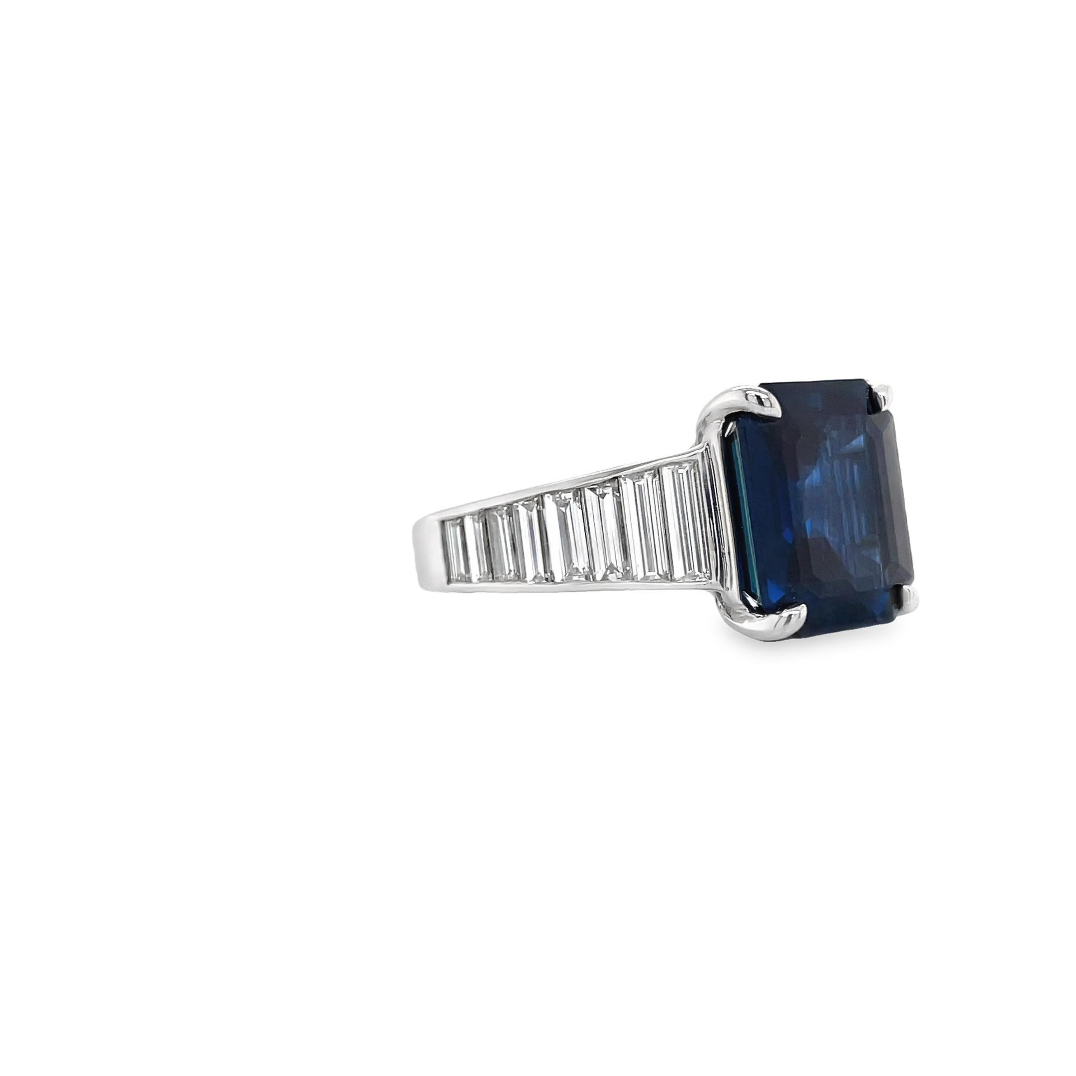 Ring contains one center emerald shape sapphire weighing 7.75ct. Center stone is accented by graduating side tapered baguette diamonds weighing a total of 1.75cts. Center sapphire is GIA certified and has no heat treatment. Sapphire and diamonds are