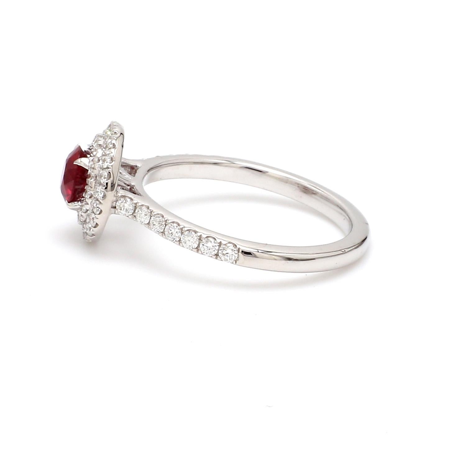 A Beautiful Handcrafted Ring in 18 Karat White Gold  with Natural No Heat Ruby of Mozambique origin- Gem Field Mined and Brilliant Cut Diamonds Halo Ring.

Ruby Details
Weight: 0.54 carats
Exceptional Clean stone cut in Diamond Facets with very nice