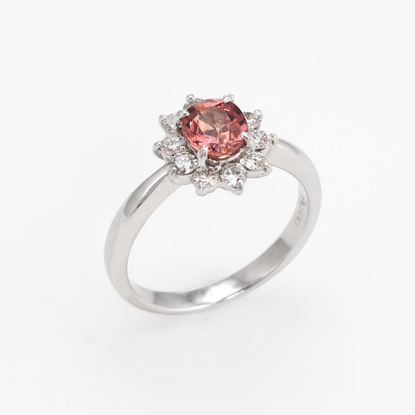 Elegant & finely detailed natural Padparadscha pink sapphire & diamond ring, crafted in 900 platinum. 

One oval shape mixed cut natural Padparadscha sapphire, 0.77 carats (5.95 x 5.00 x 3.05 mm), medium pinkish-brownish orange color, lightly