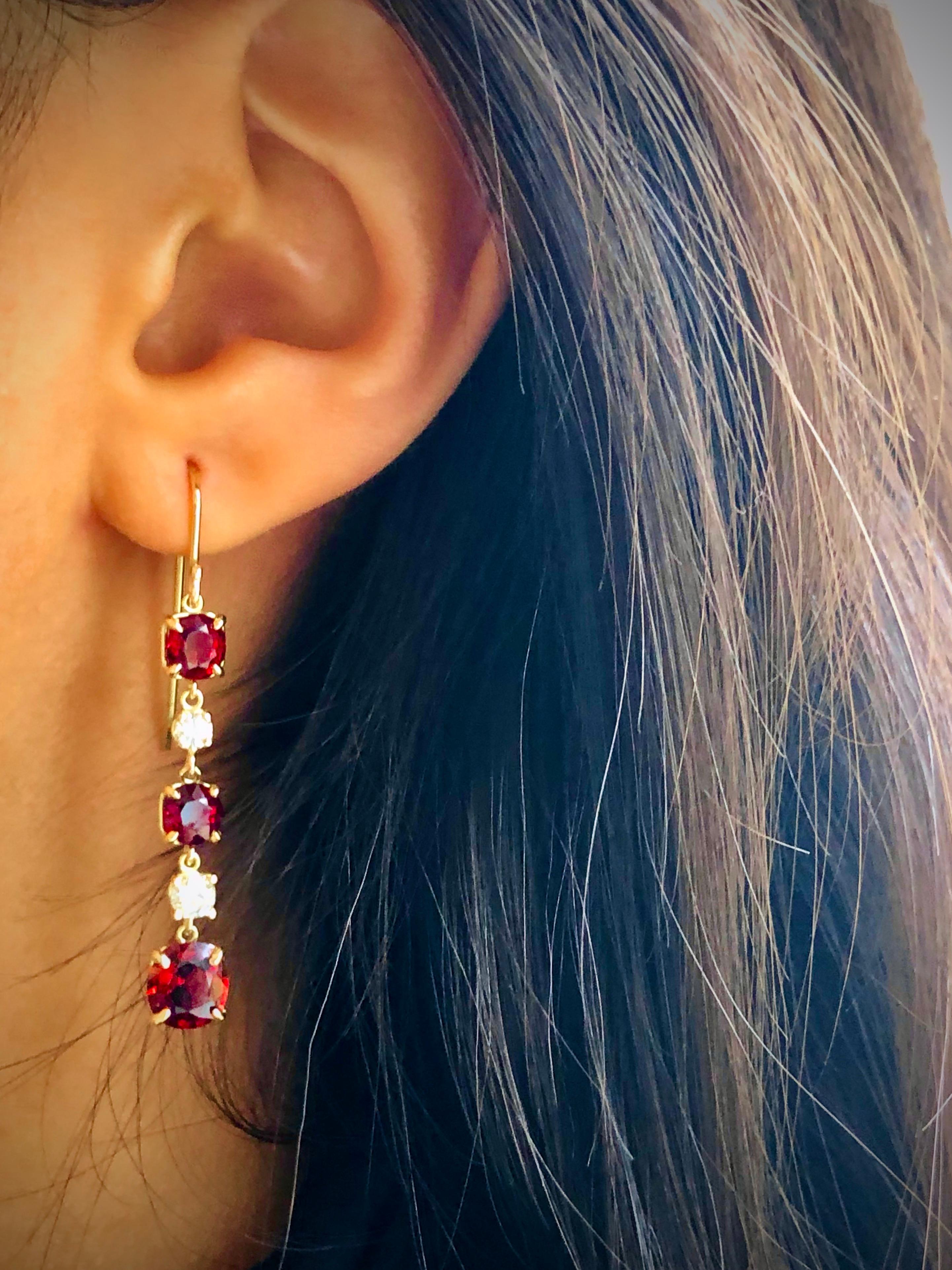 Ultra fine unheated Burma Red Spinel and Diamond Drop Earrings in 18K Yellow Gold. 
The cushion cut red spinel pair on bottom weigh a total of 3.02 carats and the four antique cushion cut spinel on the top weigh a total of 3.05 carats.  The four