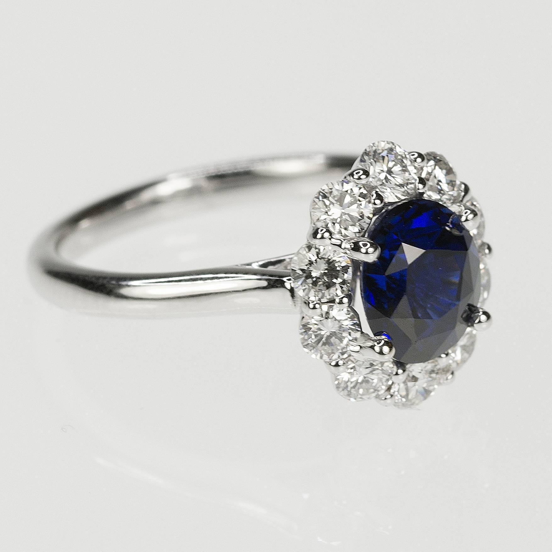 18k white gold ring with certified one 2.05 carat no heat sapphire and 10 round diamonds weighing 0.89 carat.