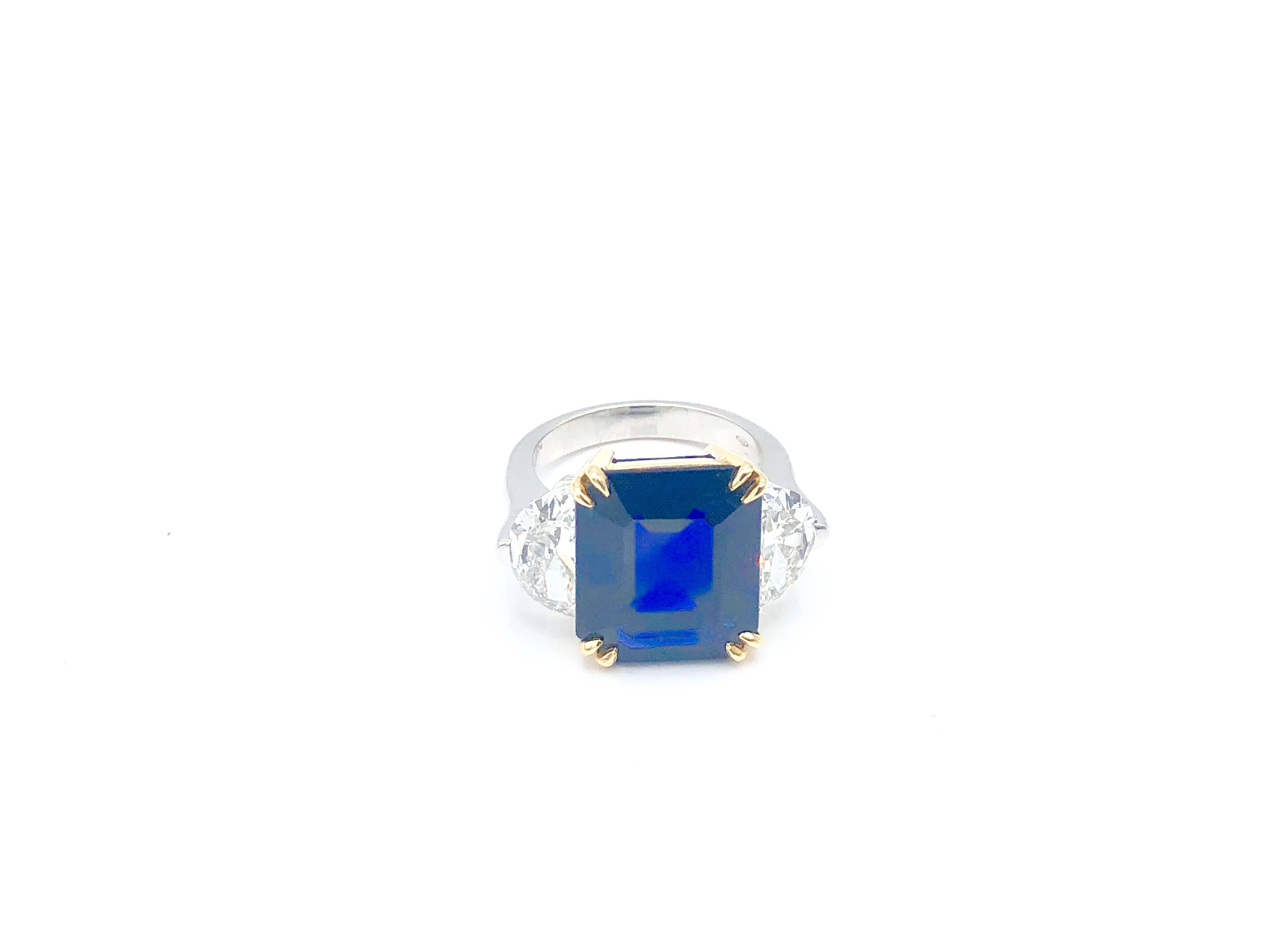 Cocktail ring featuring a beautiful emerald cut sapphire of 11,04 carats set between two trillion cut diamonds for a total weight of 3.20 carats.

Report: SSEF East Africa No Heat