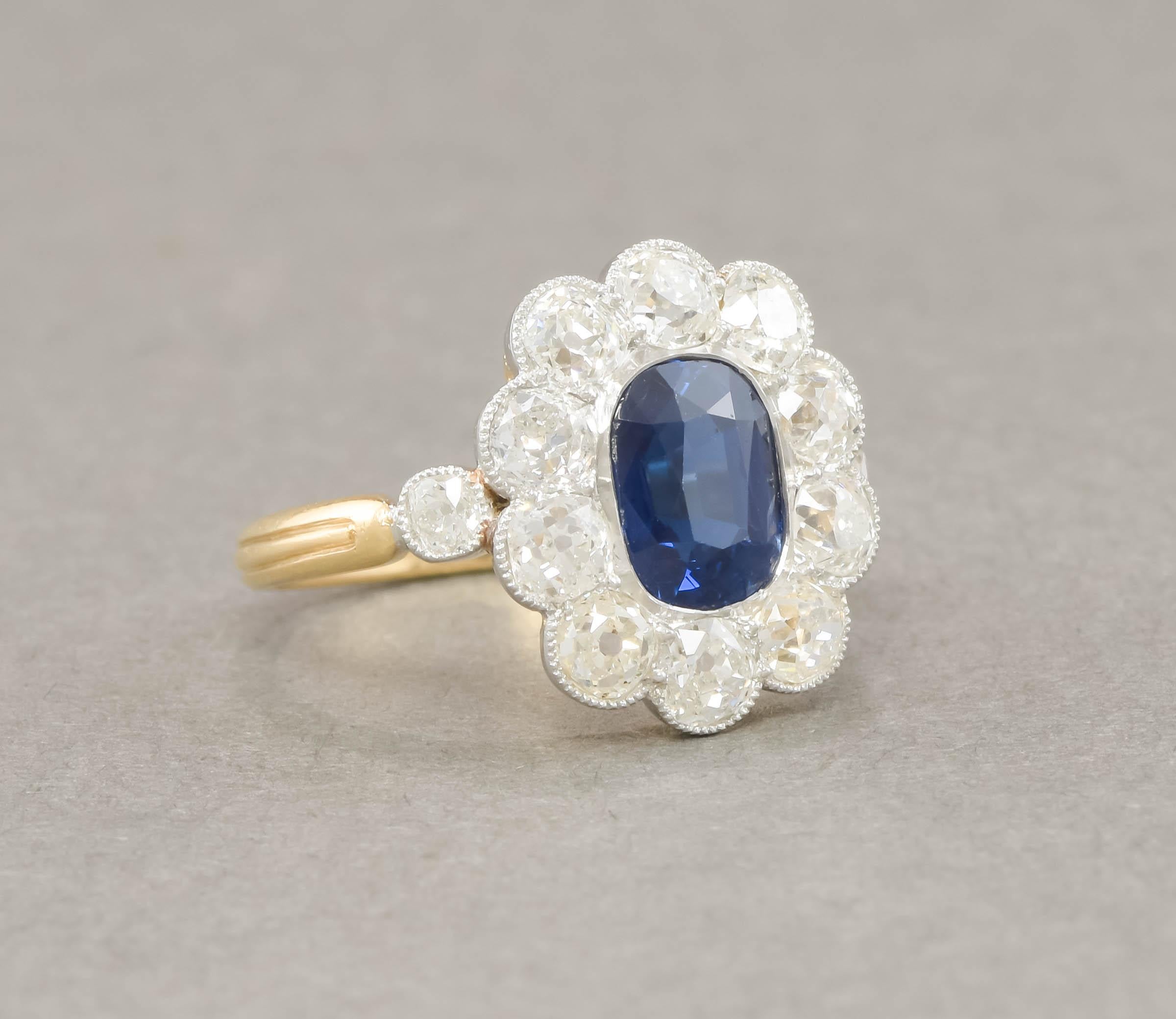 I'm pleased to offer this particularly lovely 18K gold and platinum no heat blue sapphire and old cut diamond ring, that comes with its AGL prestige gemstone report.  Total estimated gem carat weight in the ring is estimated at approximately 3.89