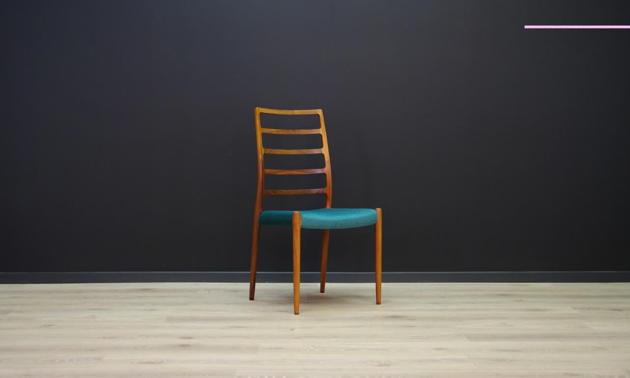 Fantastic chair from the 1960s, Danish design designed by N.O. Moller for J.L. Møllers, model 82. Original upholstery (green color), construction made of rosewood. Preserved in good condition (minor scratches), directly for use.

Dimensions: