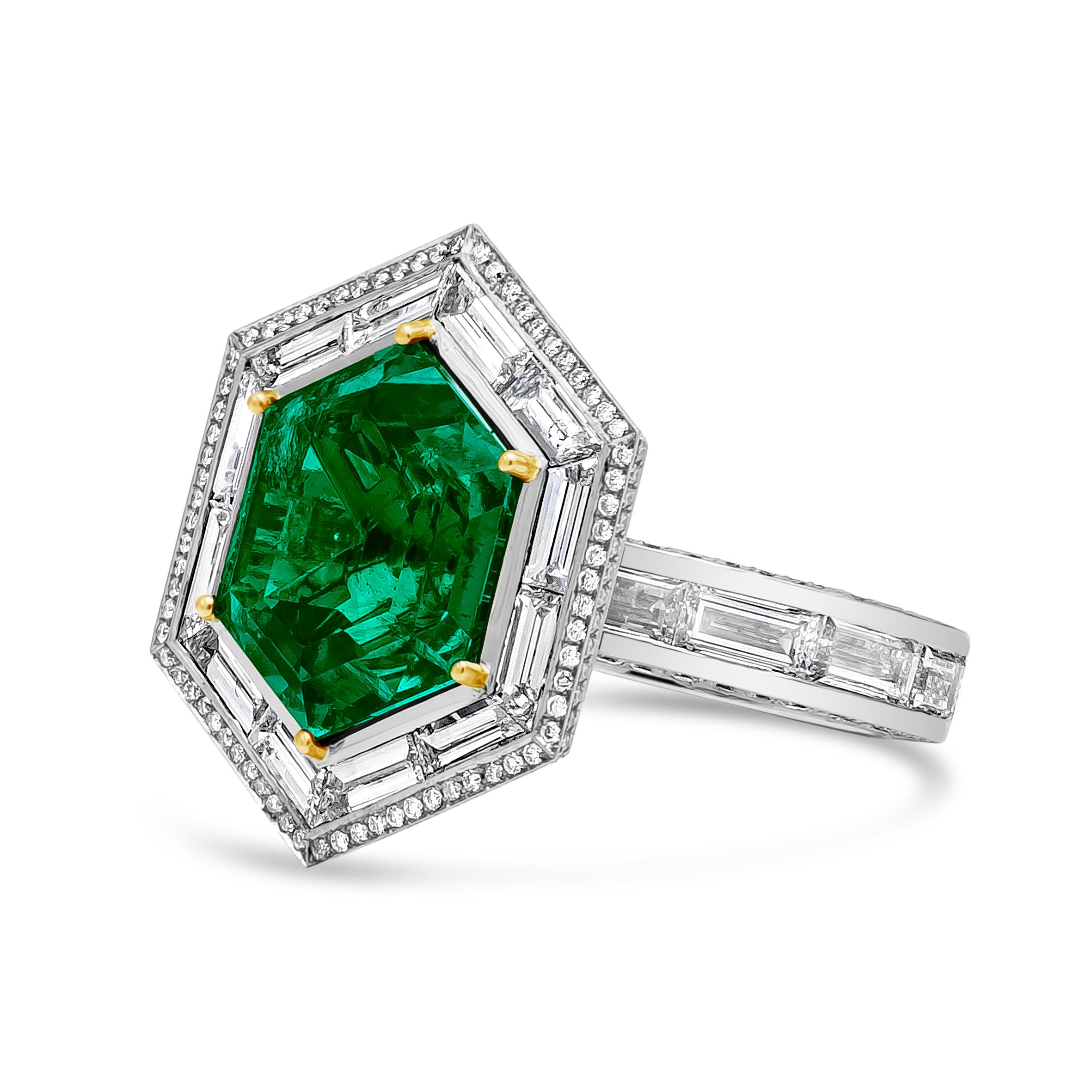 This elegant and well crafted high end jewelry fashion ring features 9.28 carat hexagon cut green emerald center stone surrounded by 12 pieces baguette cut diamonds and 72 brilliant round diamonds. 16 baguette cut diamonds are in the bottom of the