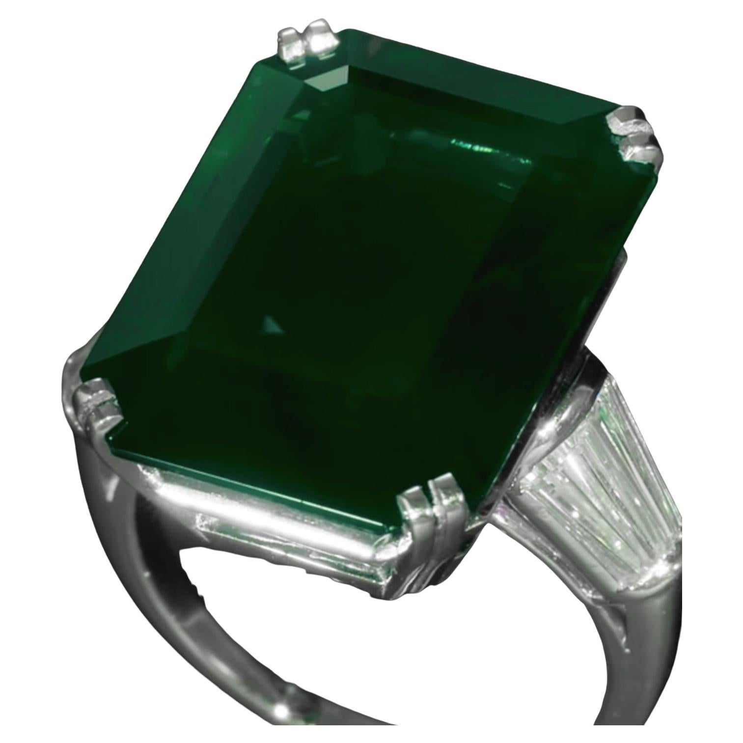 In der Mitte ein unbehandelter grüner Smaragd, flankiert von zwei spitz zulaufenden, baguettförmigen Diamanten, gefasst in massivem Platin

Smaragd mit einem Gewicht von 8.84 Karat
Größe 6
Platin
Begleitet von einem GIA-Bericht