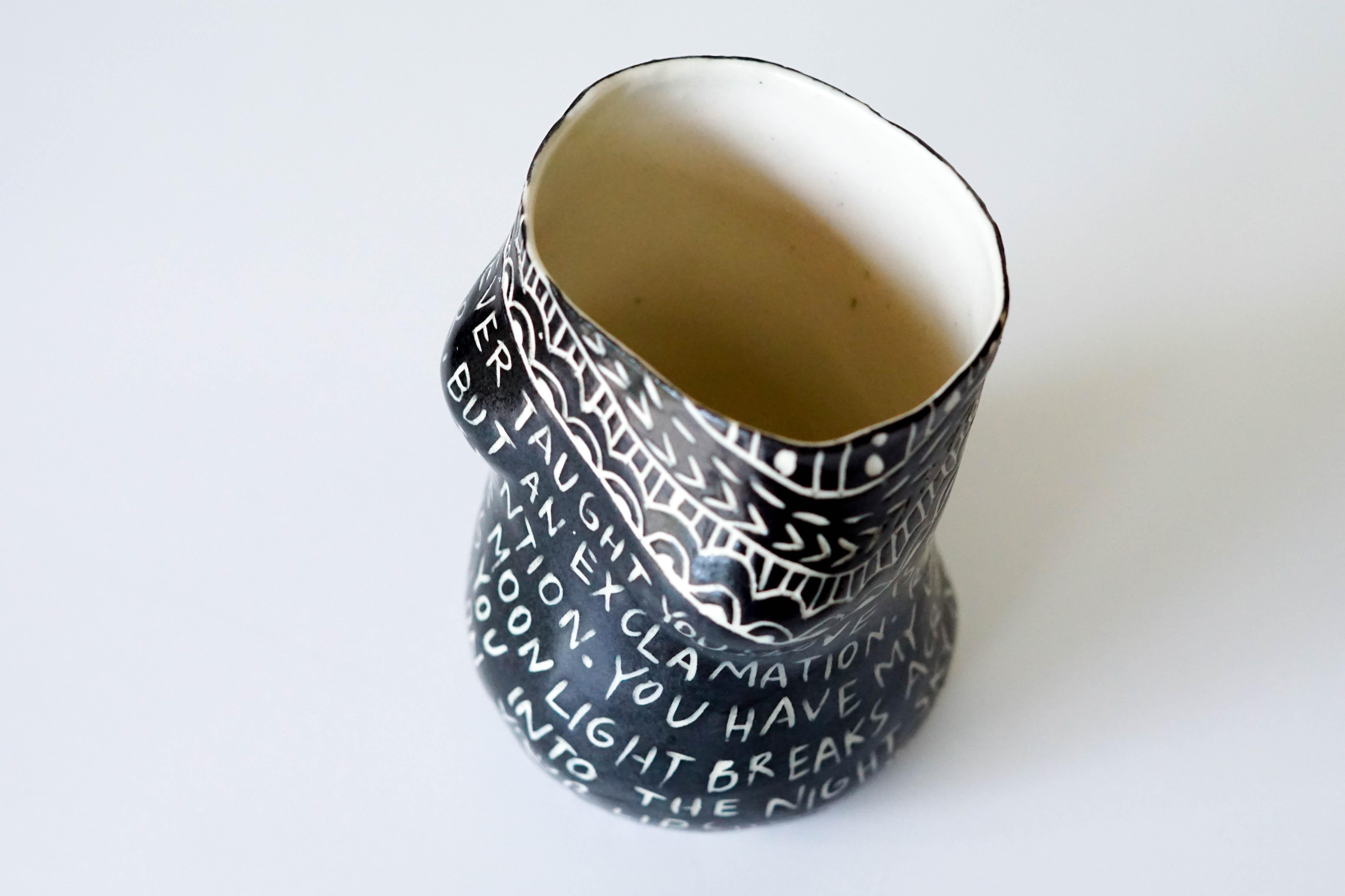 “No one ever taught you...” Porcelain Cup with Sgraffito Detailing 1