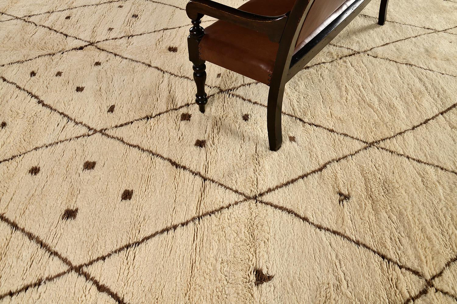 Be captivated by this luxurious carpet from Morroco. lt has a diamond pattern through the natural light brown rug and showcases the design in outlined-contrast which made it more unique. Sink your feet into a Middle Atlas Tribe kind of rug that will