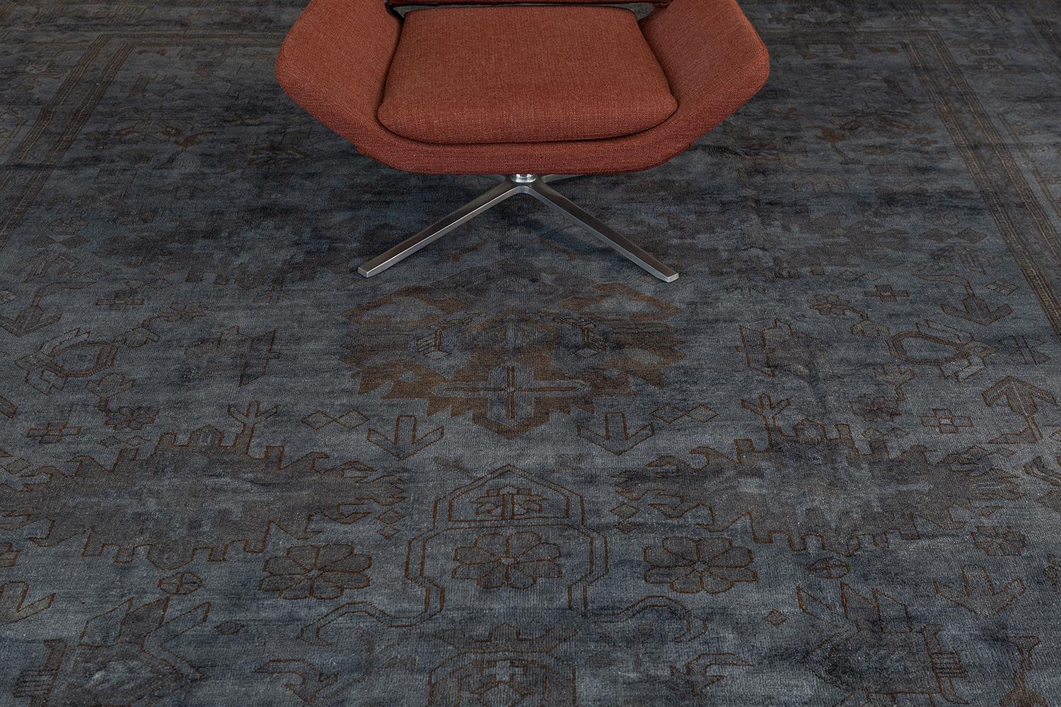 This fancy hand-spun wool over-dyed Oushak rug features the unnoticeable symmetrical palmettes, motifs, and medallion that are interwoven with this design. Different motifs are partly shown to create one of the most impressive rug designs. Saturated