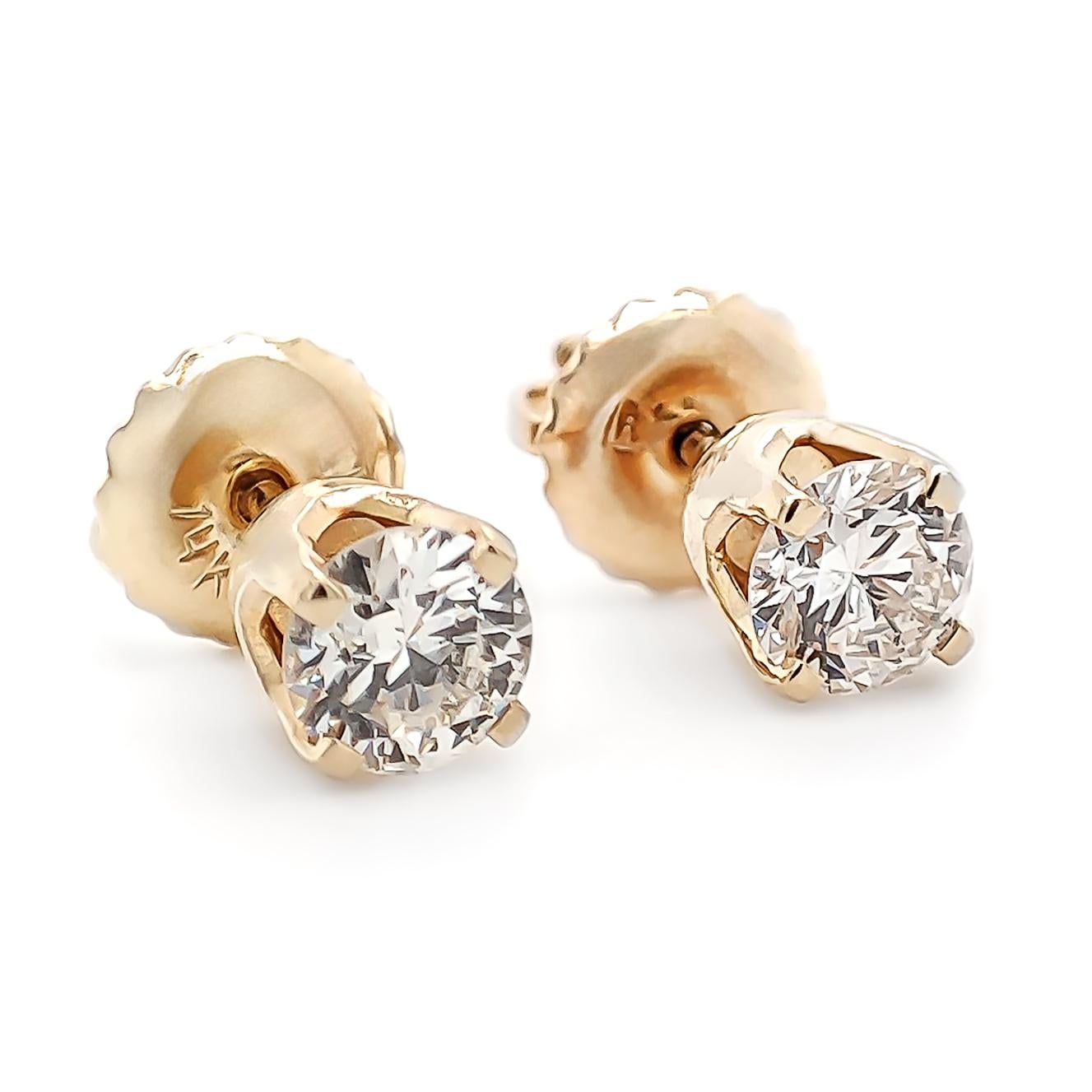 FOR U.S. BUYERS NO VAT 

If you want to add color to any style you choose, these 14kt diamond stud earrings weighing 0.78 grams are definitely for you. These gorgeous earrings feature two round brilliant cuts set in 14kt Yellow gold totaling 0.50