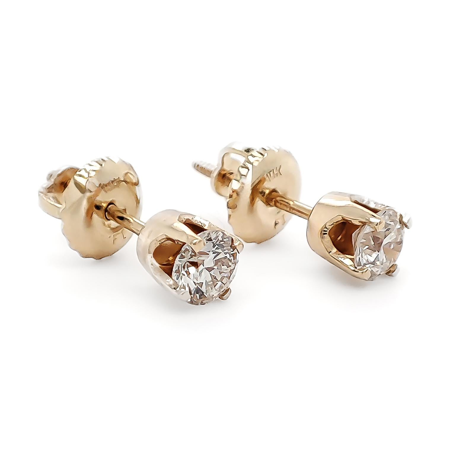 FOR U.S. BUYERS NO VAT 

If you want to add color to any style you choose, these 14kt diamond stud earrings weighing 0.79 grams are definitely for you. These gorgeous earrings feature two round brilliant cuts set in 14kt Yellow gold totaling