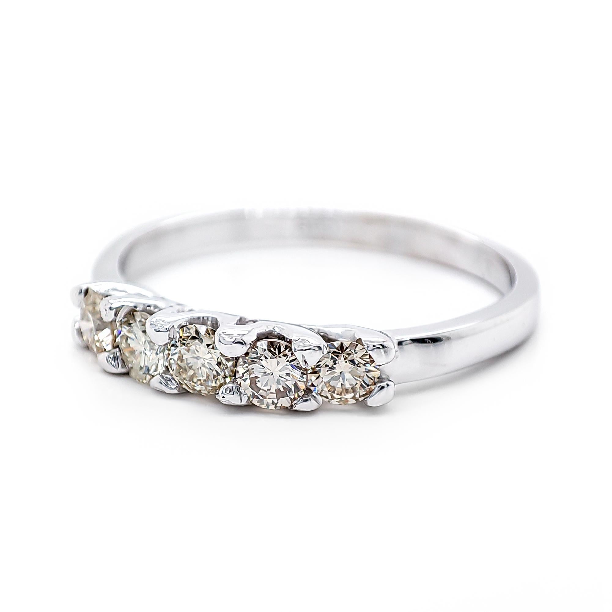 FOR U.S. BUYERS NO VAT NO CUSTOMS FEES

This elegant ring features 5 dazzling diamonds, totaling 0.55 carats. The diamonds range in color light color and have exceptional clarity, ensuring remarkable brilliance and sparkle. Set in 14k white