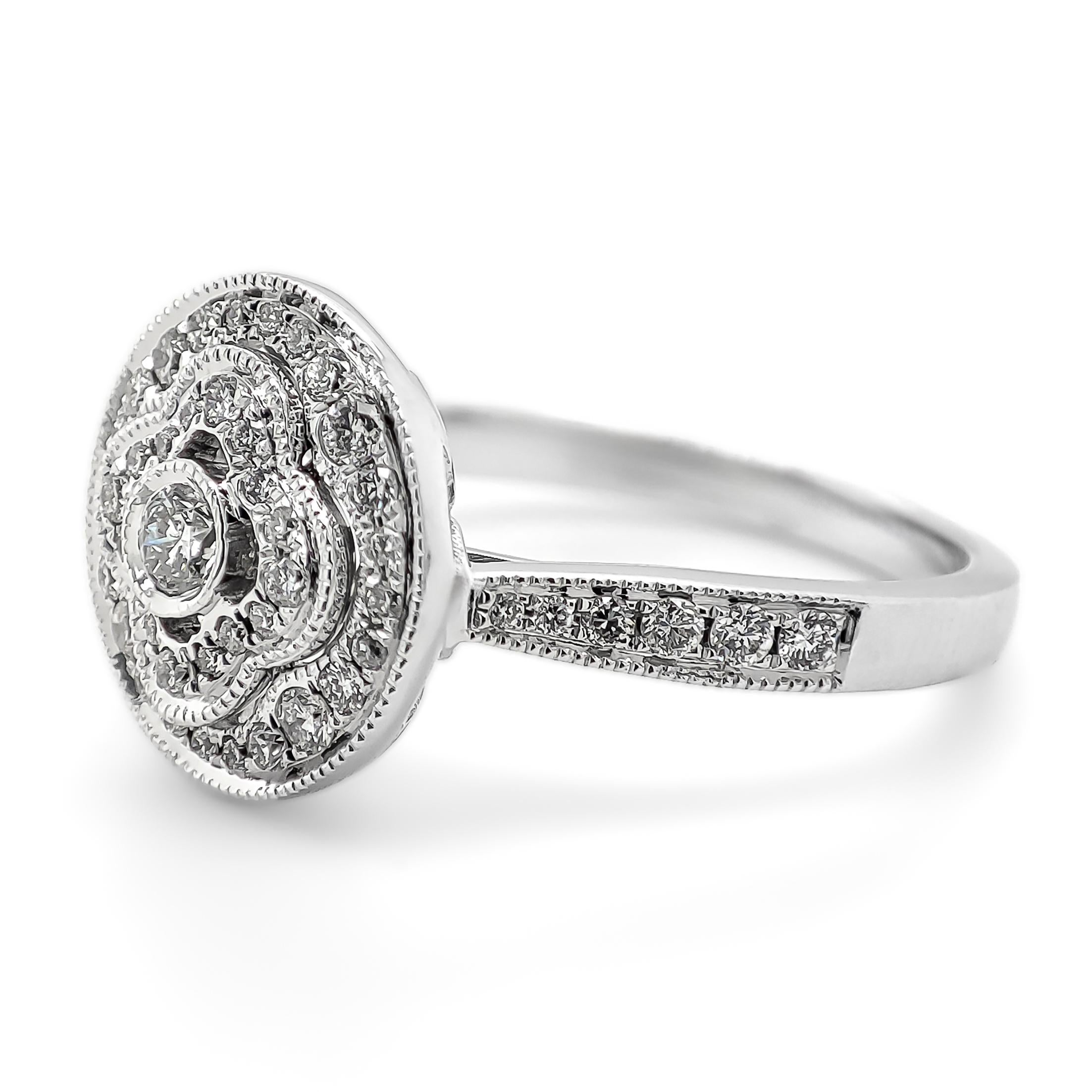 FOR US CUSTOMER NO VAT!

This stunning engagement diamond ring features a captivating 0.72 carat diamond with a color grade ranging from D to F, showcasing exceptional whiteness and brilliance.

Crafted in 14K white gold, the ring has a substantial