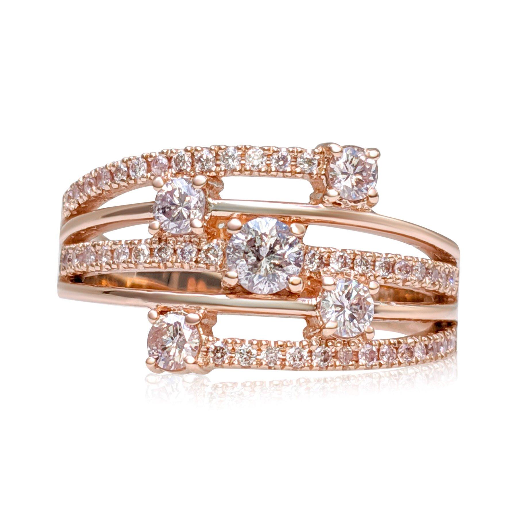 This exquisite ring features 0.81 carats of natural colored light pink and fancy light pink diamonds, beautifully arranged in a 14 kt rose gold setting. The delicate pink hues of the 49 diamonds are perfectly complemented by the warm, romantic glow