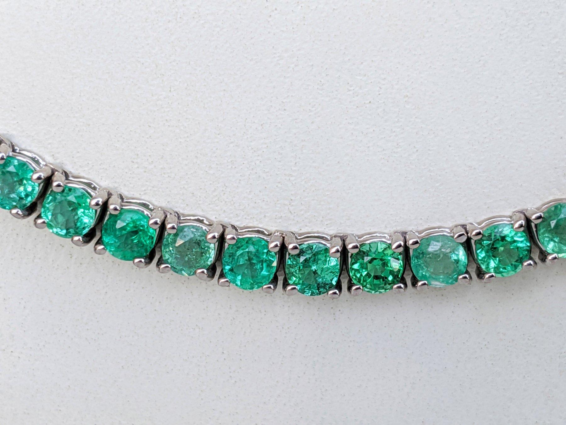 Center Emerald Stone:
Weight: 10.40 ct / 130 pieces
Color: Green
Shape: Round Brilliant
Minor clarity enhancement

Item ships from Israeli Diamonds Exchange, customers are responsible for any local customs or VAT fees that might apply to the